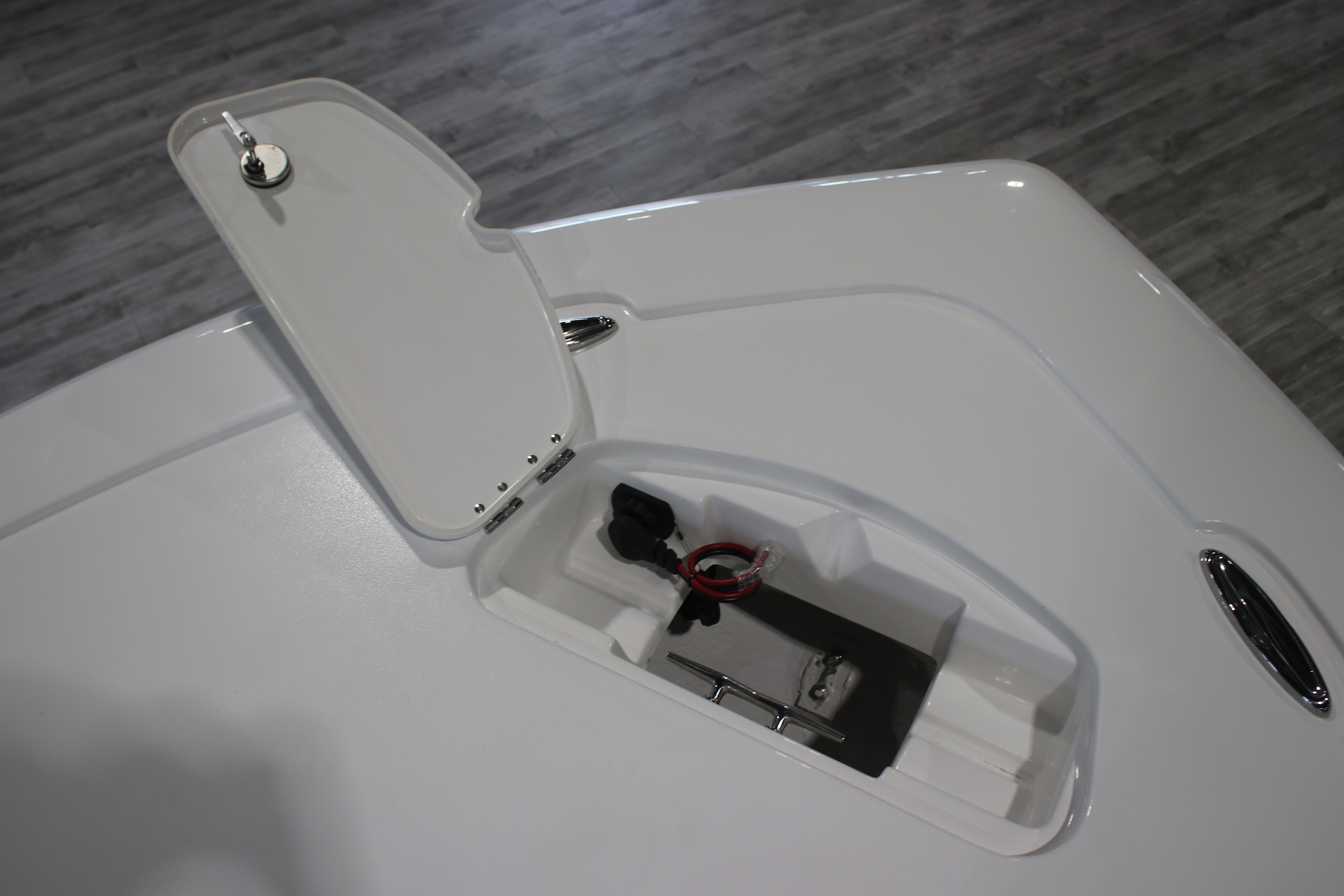 2026 Tidewater 2300 Carolina Bay boat storage compartment with open hatch.