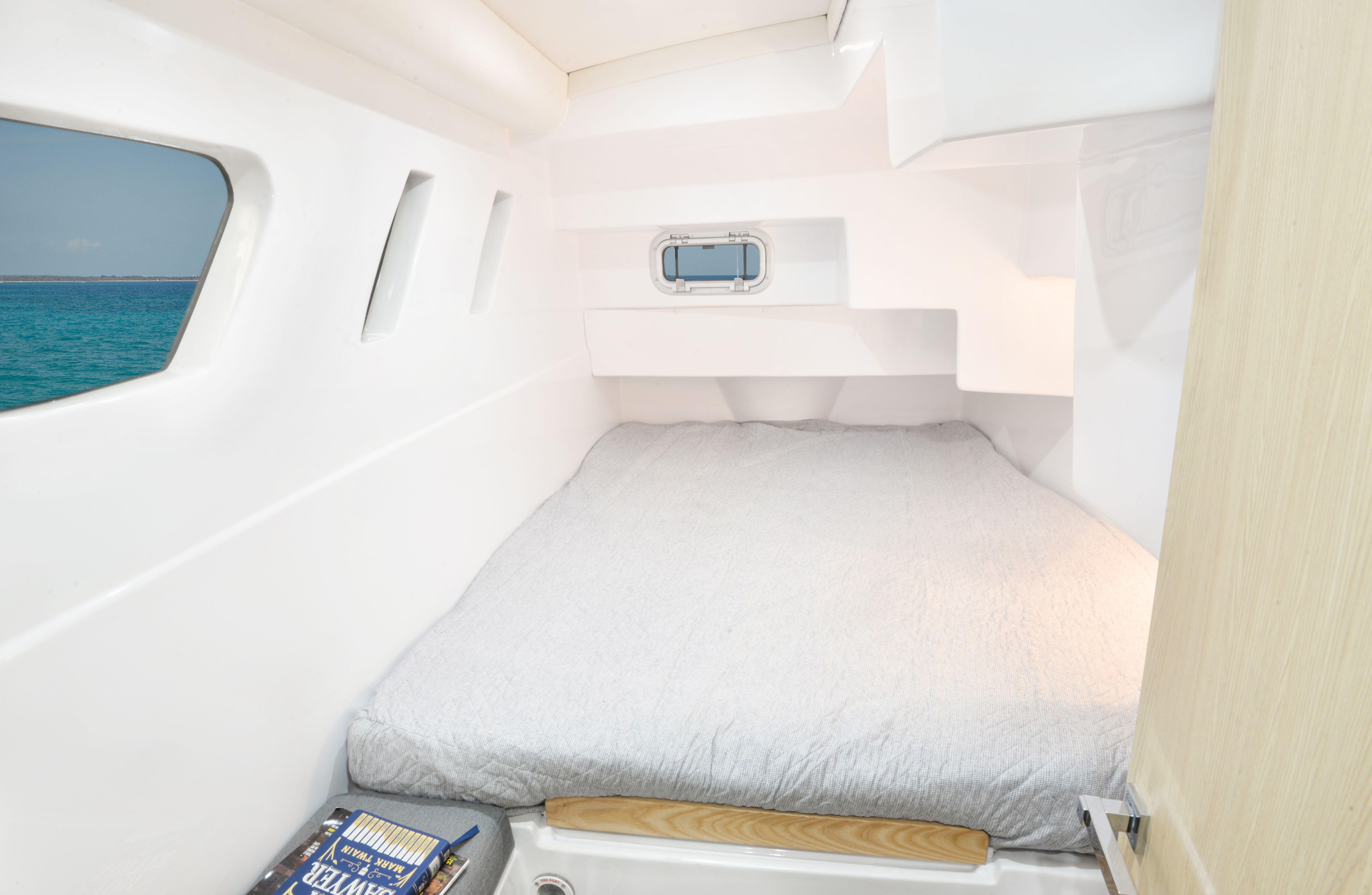 Seawind 1170 2025 model cabin interior with bed and ocean view.