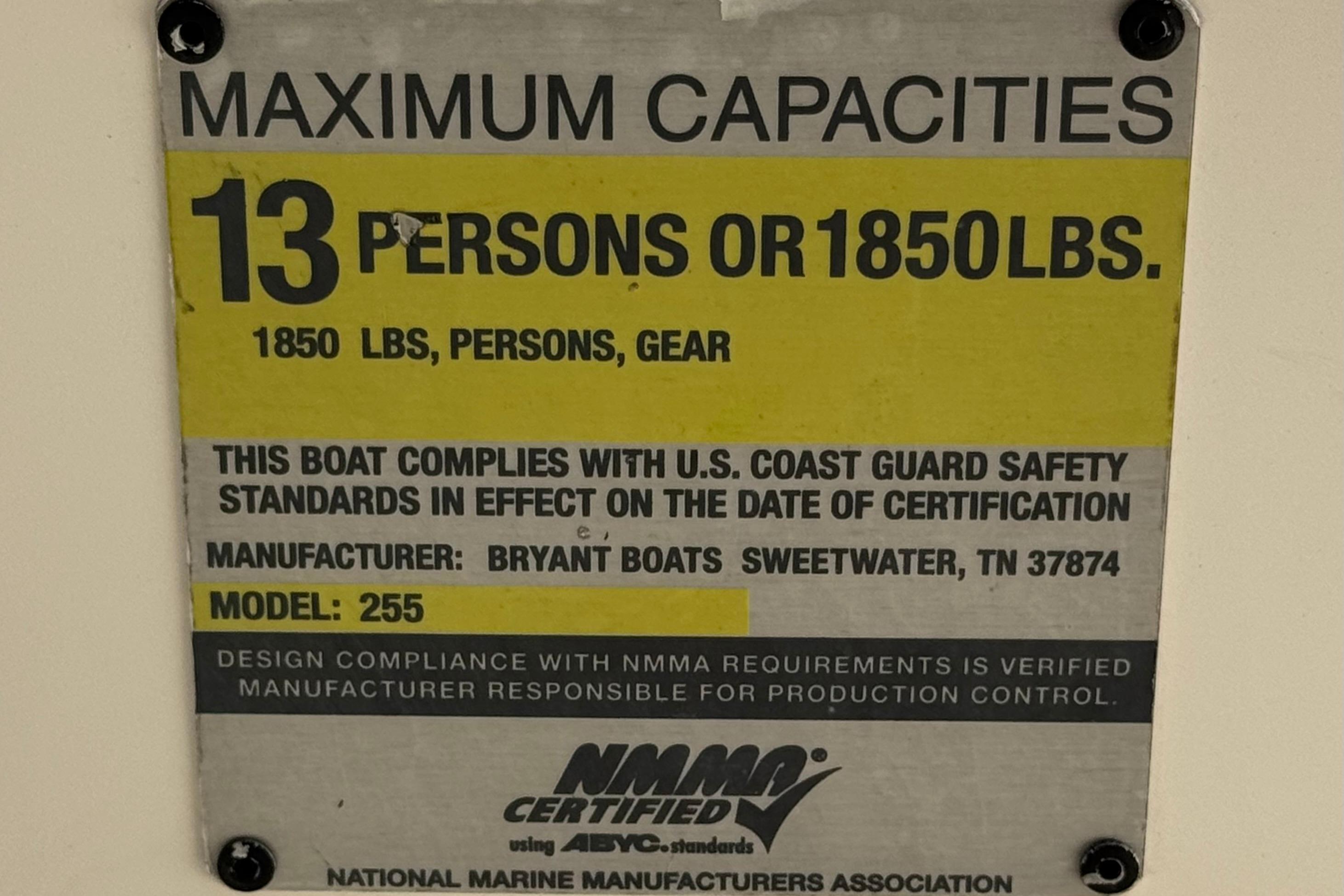 Maximum capacity sign for Bryant 255 boat, 13 persons or 1850 lbs, 2010 model.