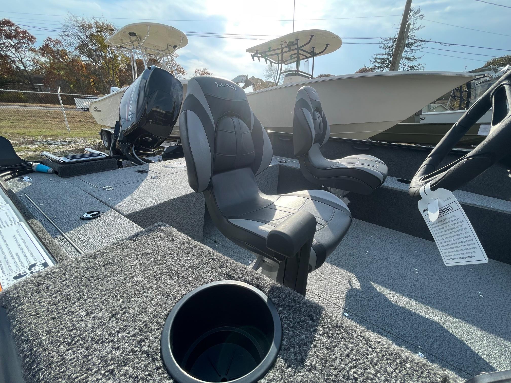 2025 Lund 1650 Rebel XL SS boat interior with seating and cup holder.