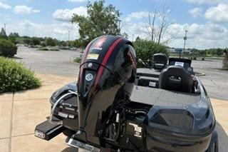 2026 Nitro Z18 boat with powerful outboard motor in a sunny outdoor setting.