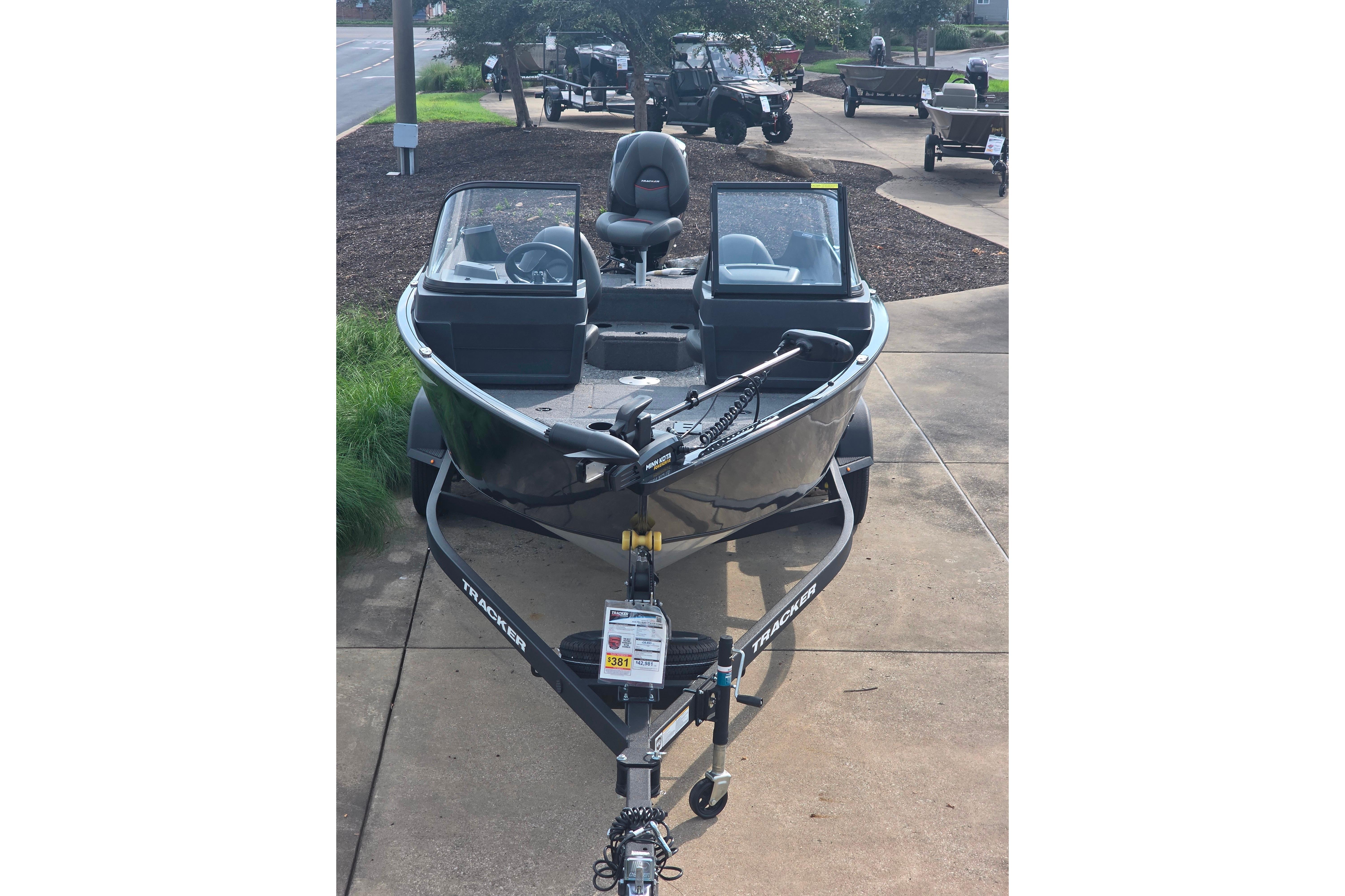 2026 Tracker Pro Guide V-175 Combo boat on trailer, parked outdoors.