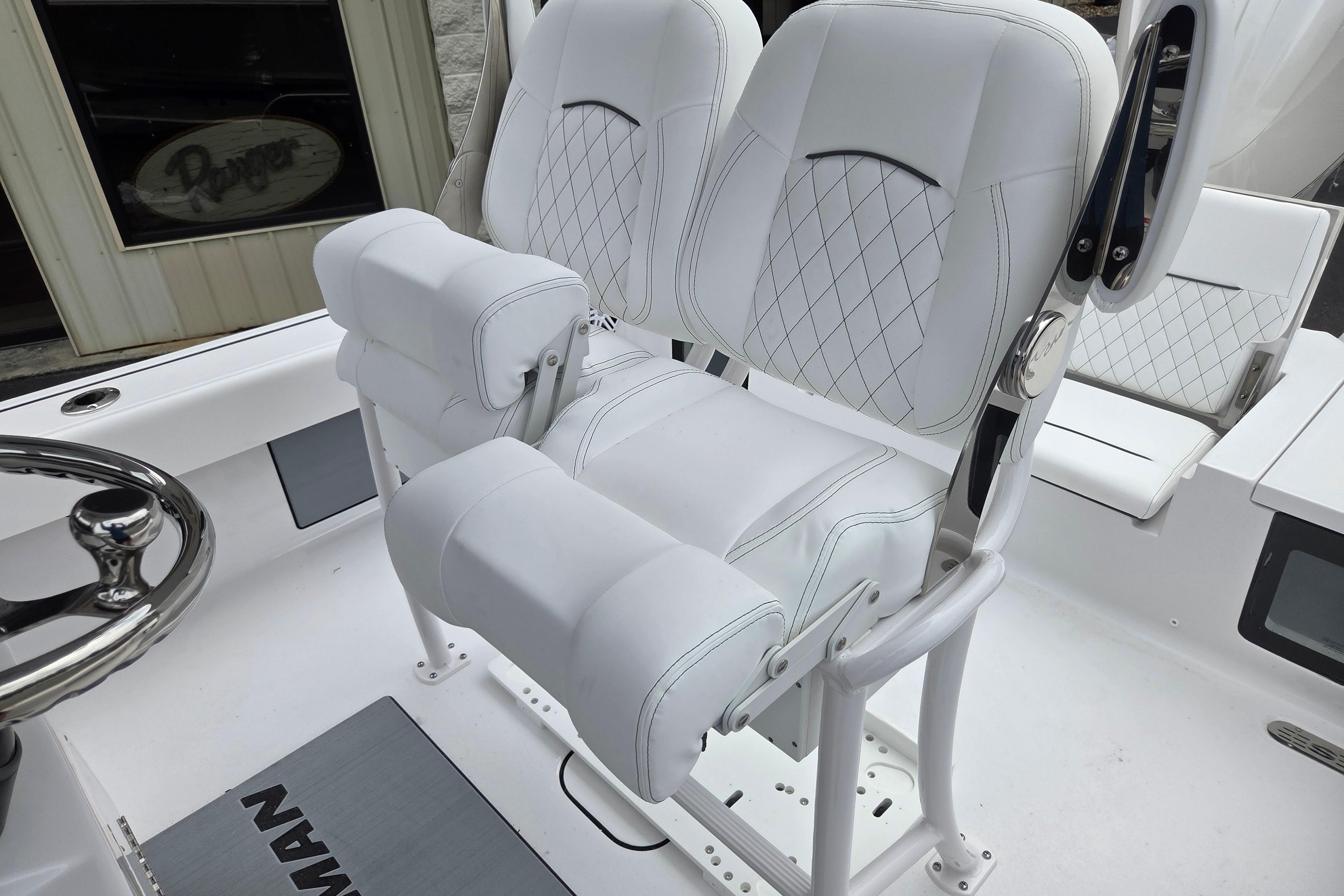 Luxurious seating on 2026 Sportsman Masters 247 Bay Boat, featuring elegant white upholstery.