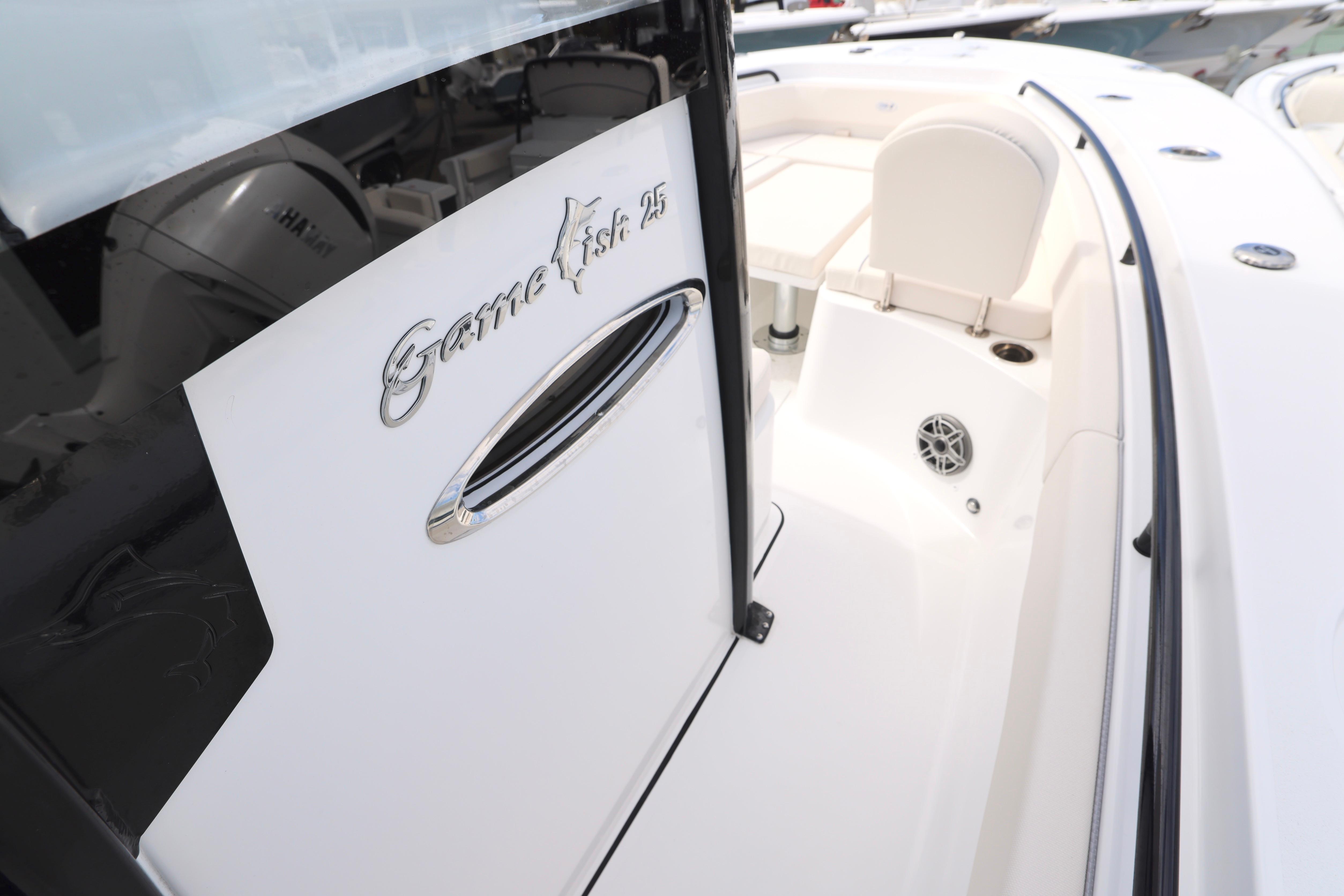 2026 Sea Hunt Gamefish 25 boat interior with seating and branding details.