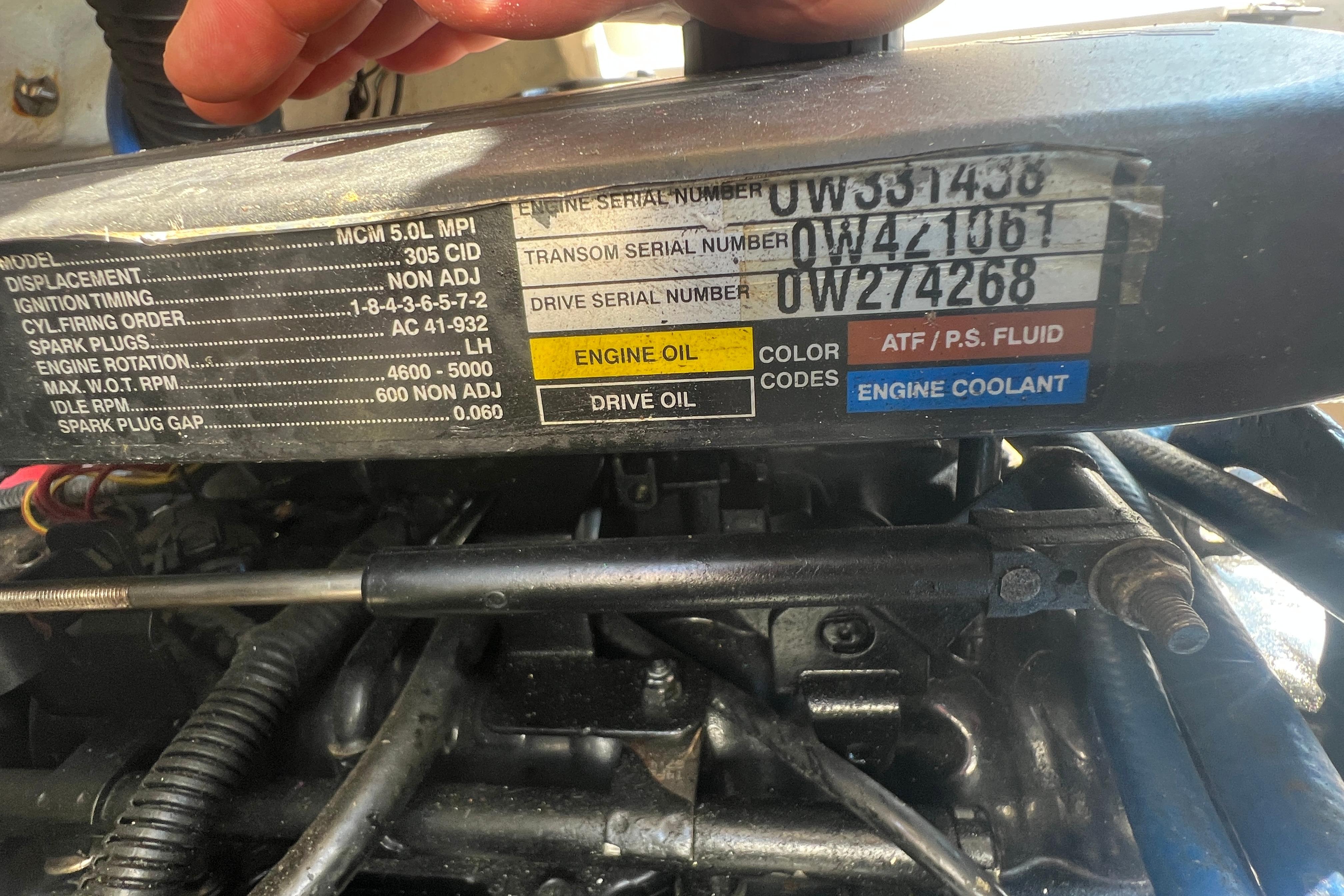 Engine specifications label on a 2005 Sea Ray 240 Sundeck boat.