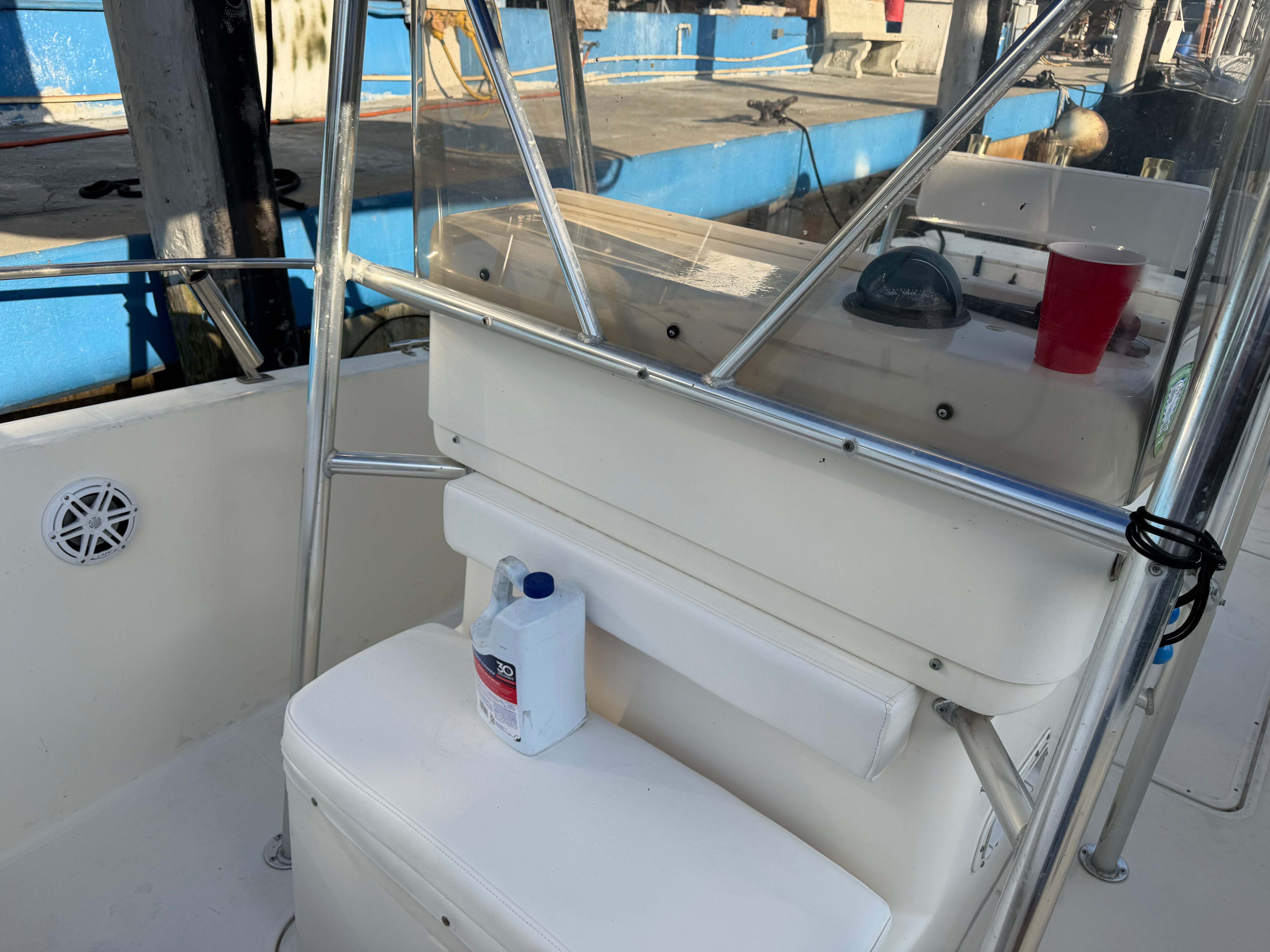 Interior of a 2004 Pursuit 2870 boat with seating and accessories.