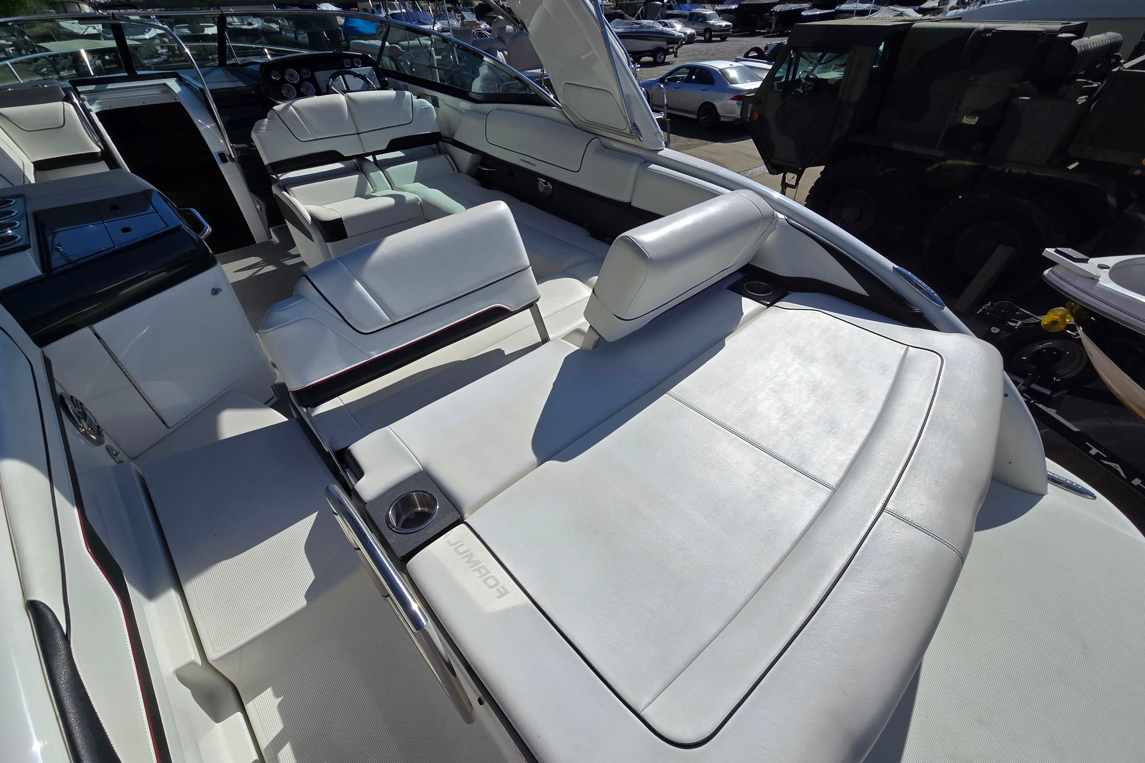 2017 Formula 310 Sun Sport boat interior with white leather seating and modern design.