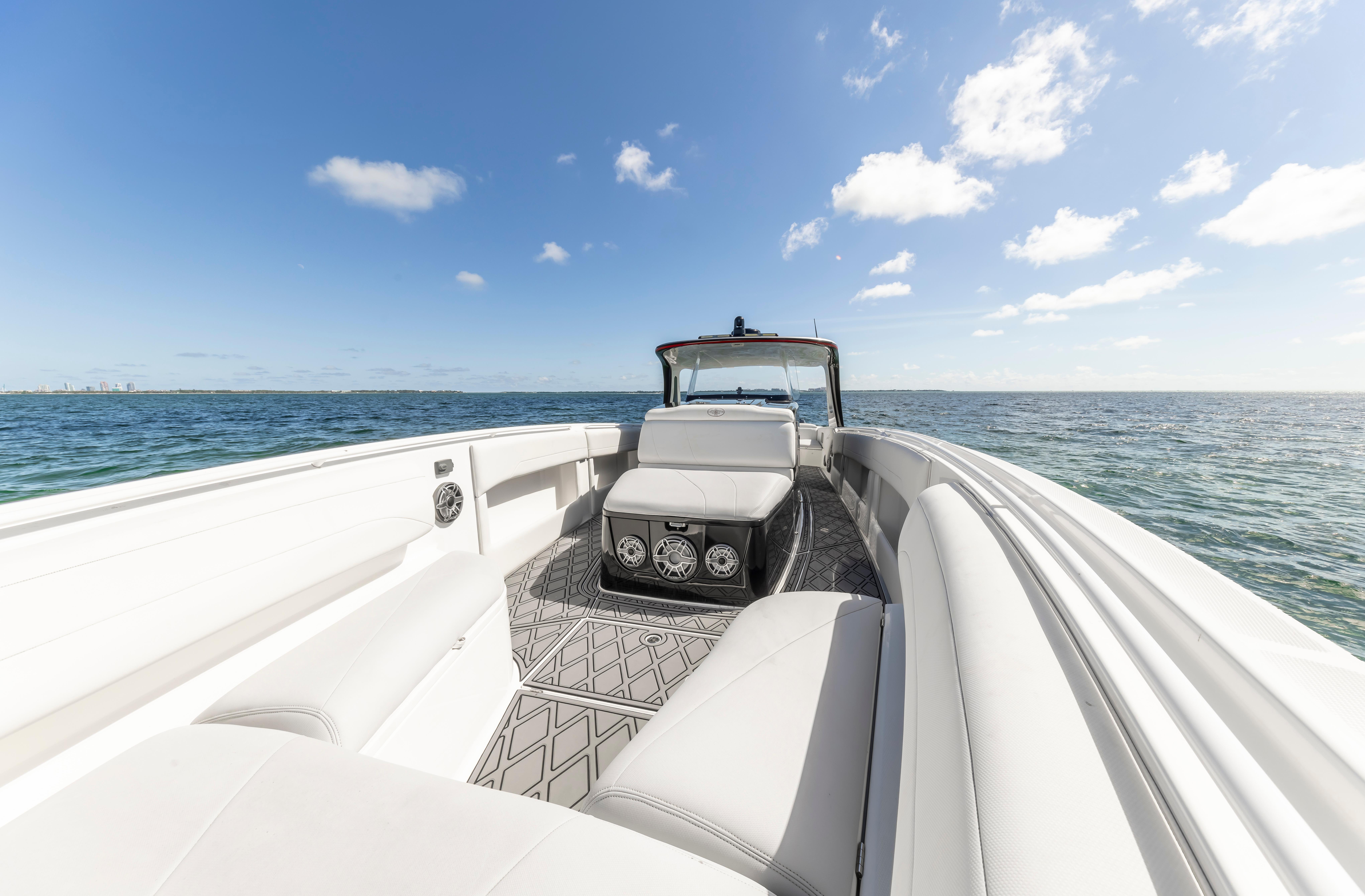 2016 Cigarette 41 GTR boat on open water under clear blue sky.