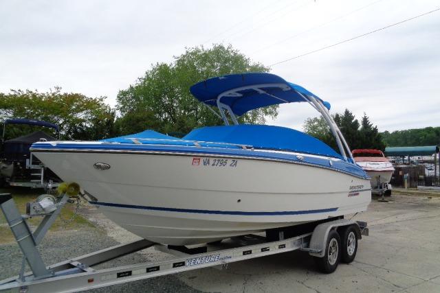 2019 Monterey 218SS Super Sport boat on trailer, blue cover, outdoor setting.