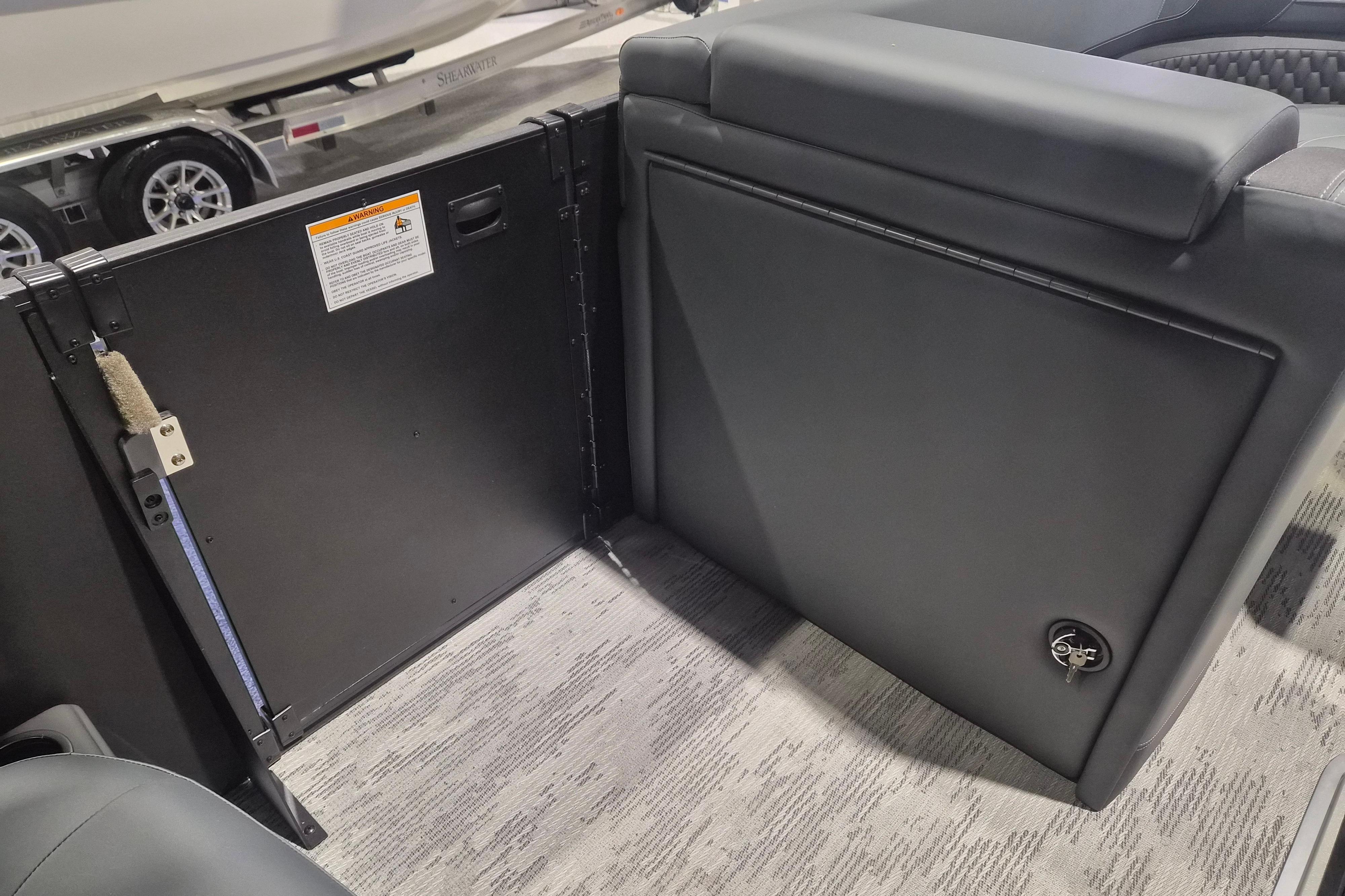 Interior view of 2026 Sylvan L3 ULZ boat, showcasing seating and storage area.