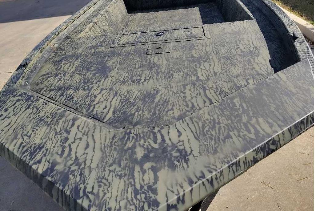 2026 Tracker Grizzly 1754 Utility boat with camouflage pattern on deck.