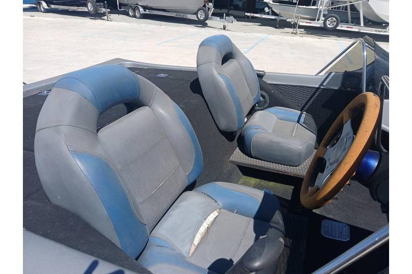 Interior of a 1994 Gambler 21 boat with blue and gray seats.
