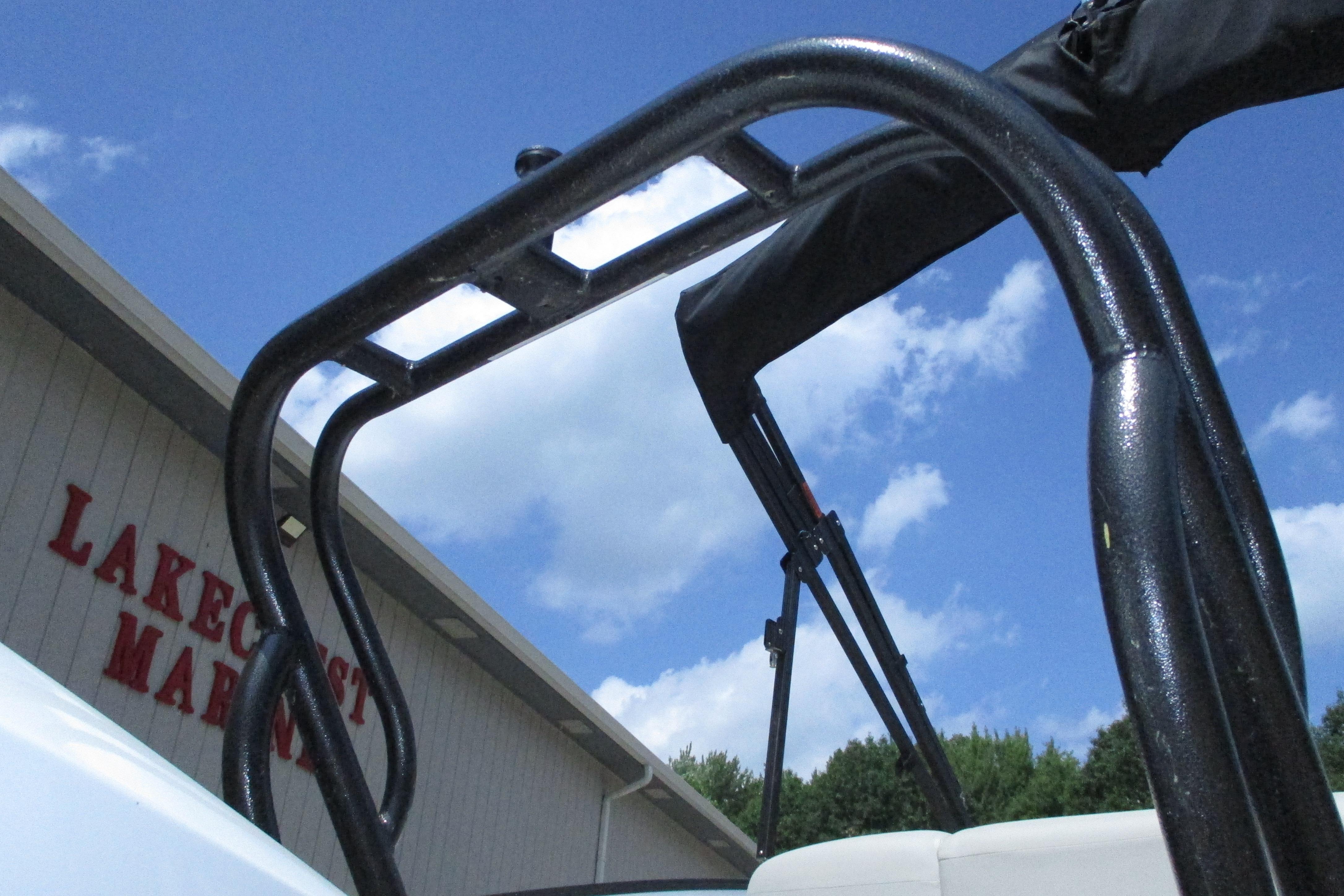 2021 Crest Caribbean LX 250 SLS boat detail against blue sky at Lakecrest Marina.