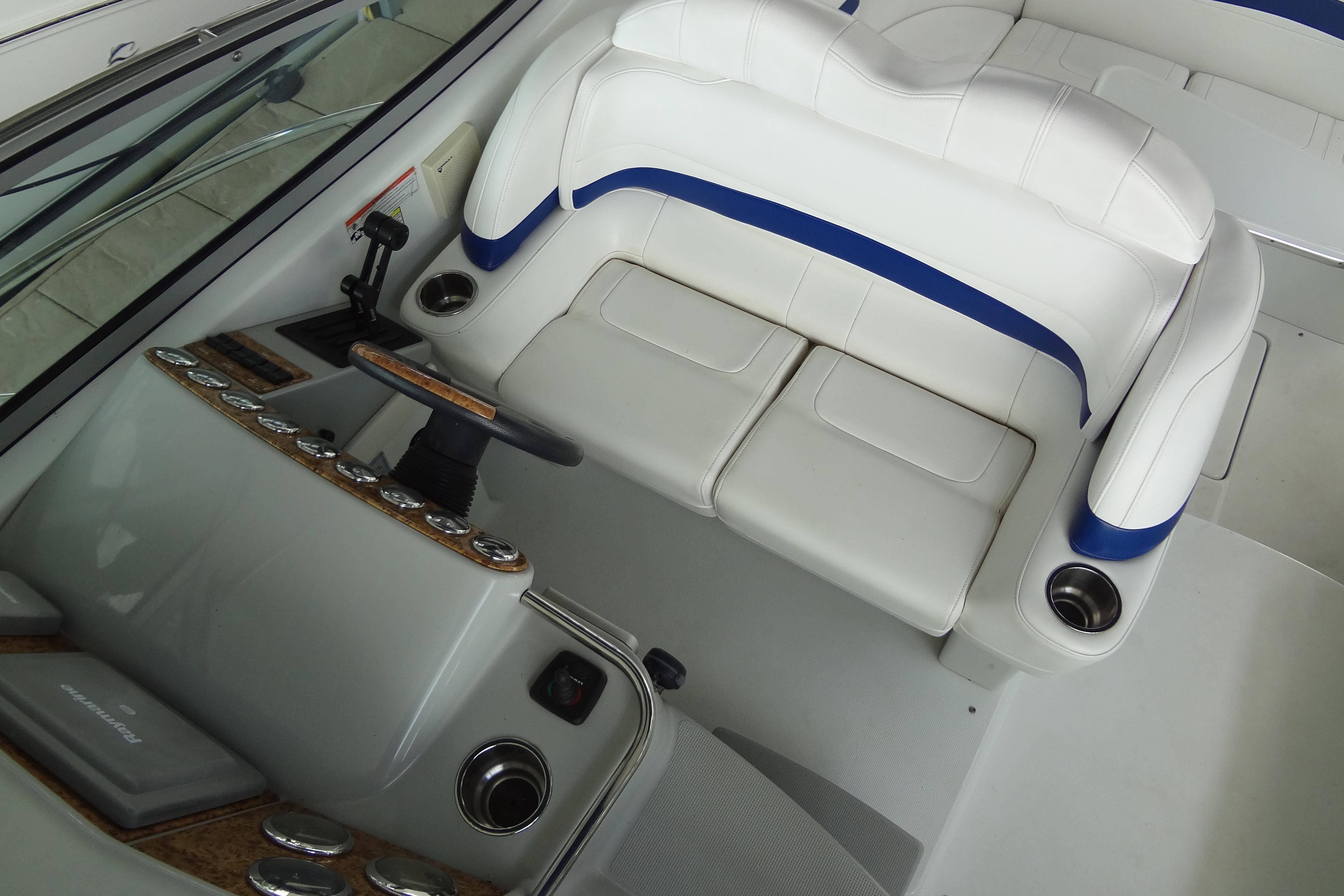 2007 Formula 34 Performance Cruiser cockpit with white and blue seating, steering wheel, and controls.