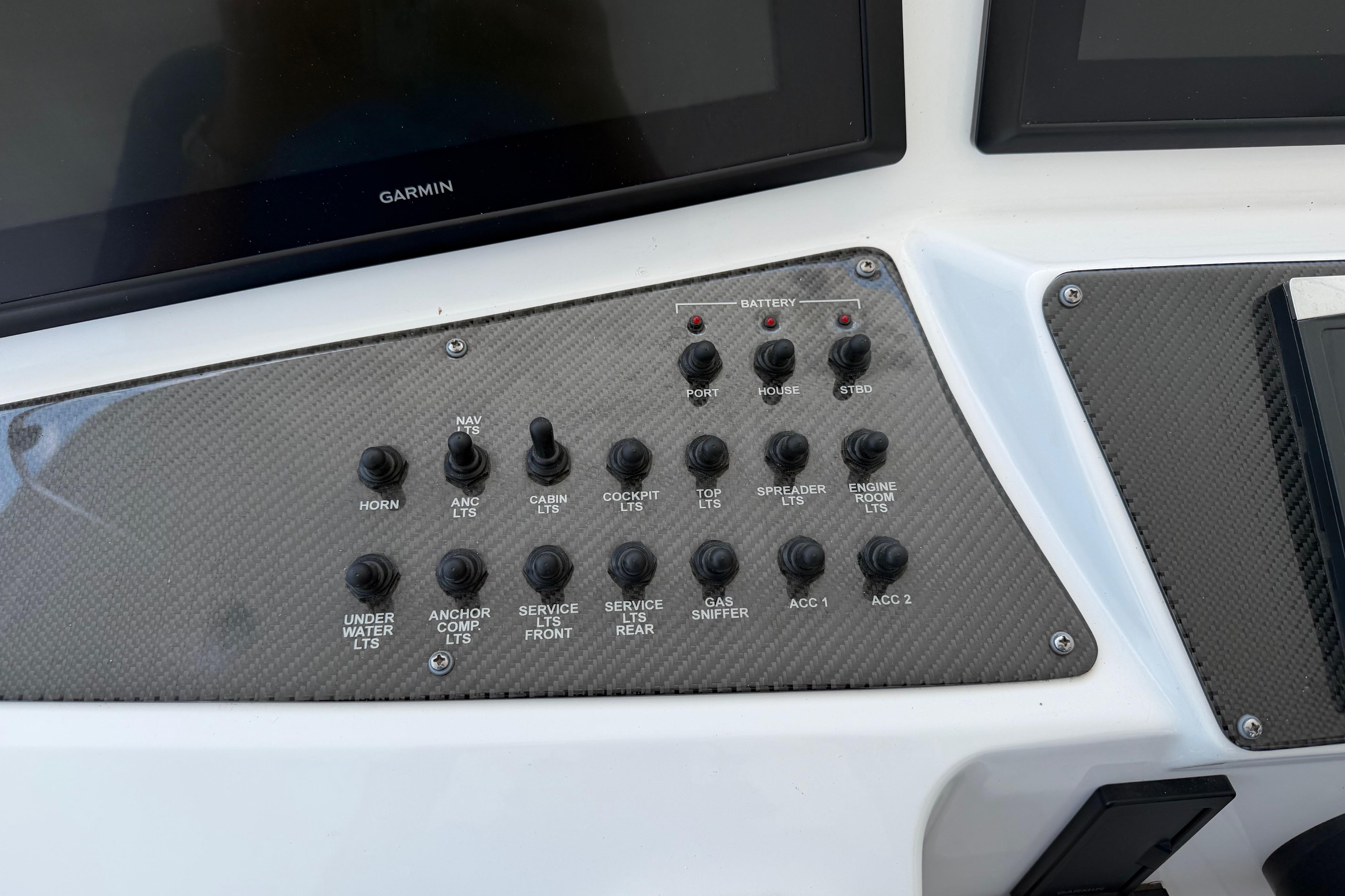 Control panel of a 2015 Cigarette 41' Nighthawk SD Edition boat with labeled switches.