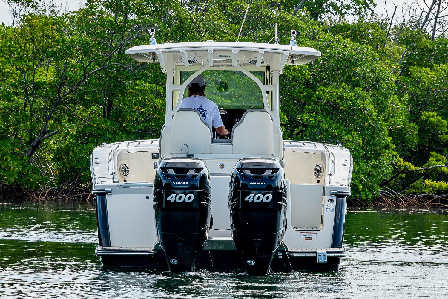 2021 Scout 330 LXF boat with dual 400 Verado engines on water.