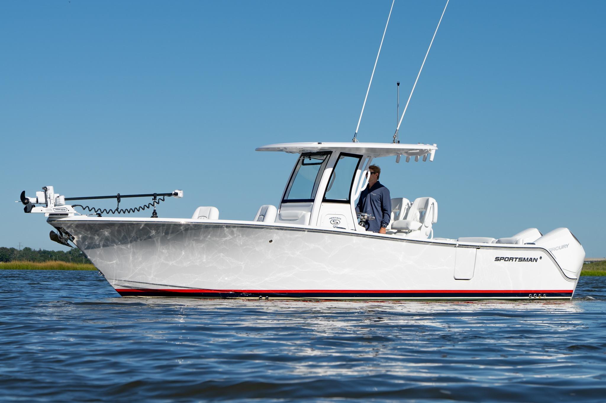 2024 Sportsman Heritage 261 Center Console boat on calm water, clear blue sky.