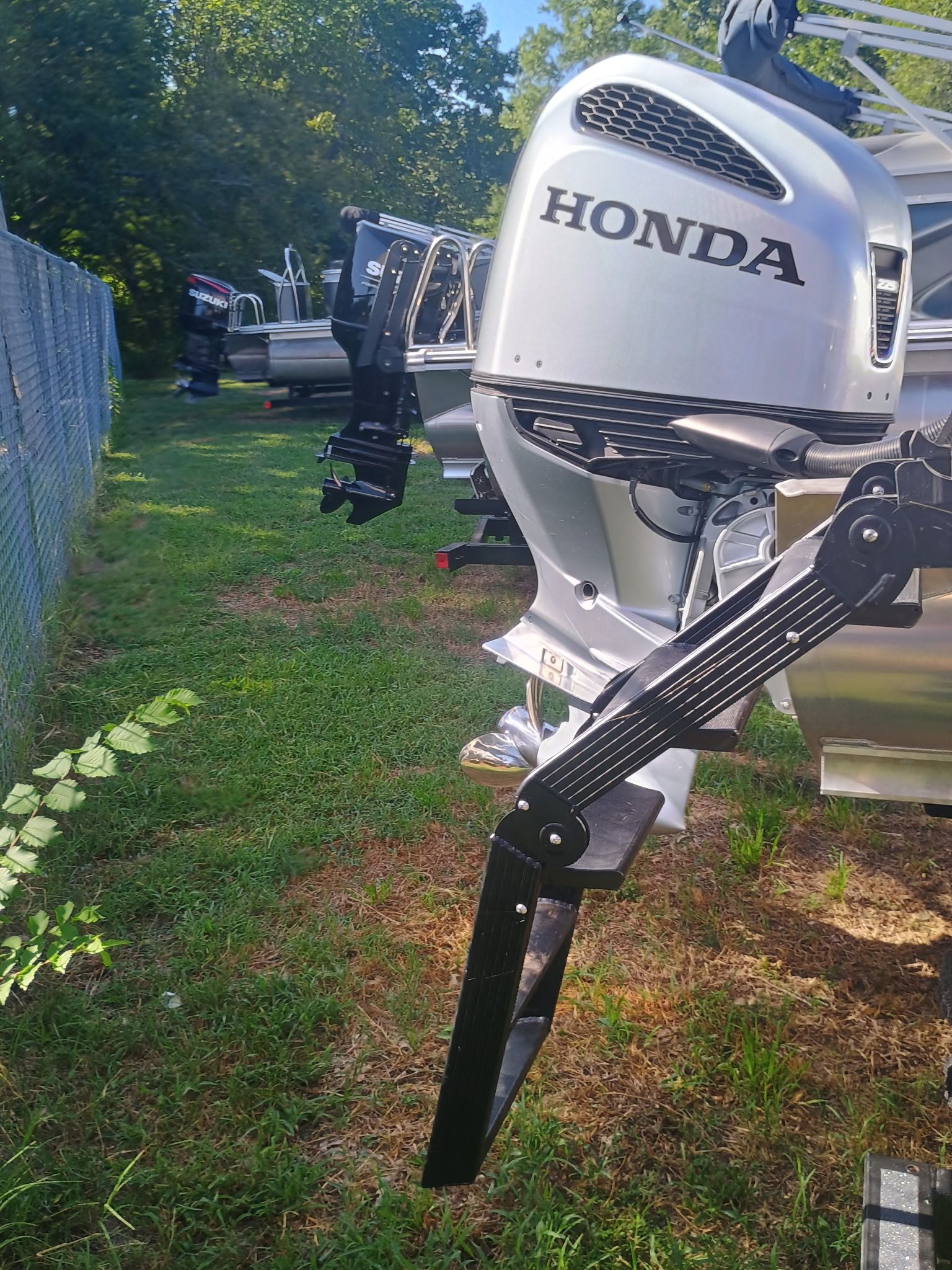 2025 Tahoe LTZ Quad Lounger Shift with Honda outboard motor.
