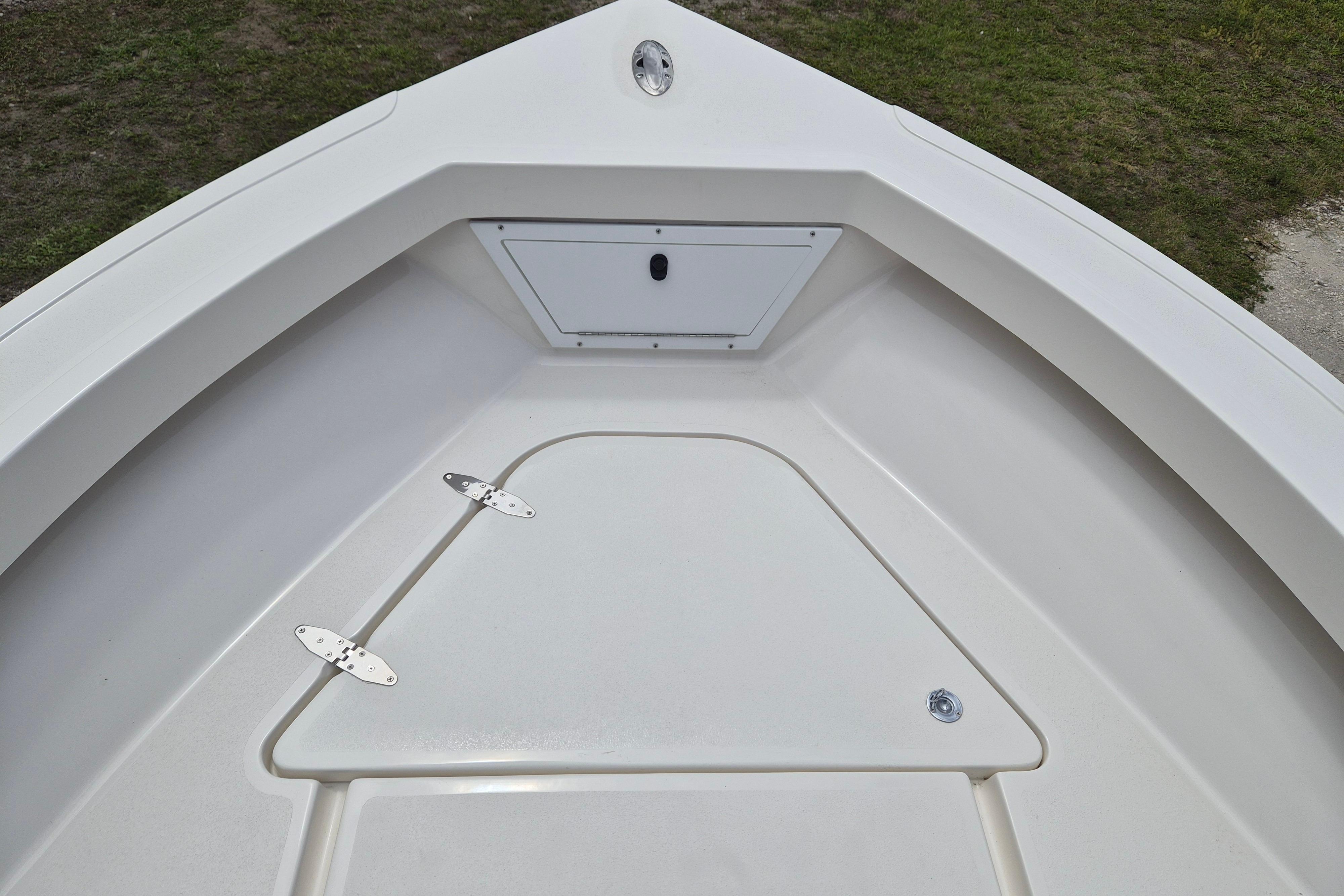 Bow area of 2026 Defiance Catalina 190 boat, featuring storage compartments and clean design.