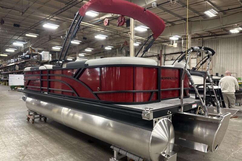 2026 Bennington 22 SSRSF pontoon boat in a factory setting.