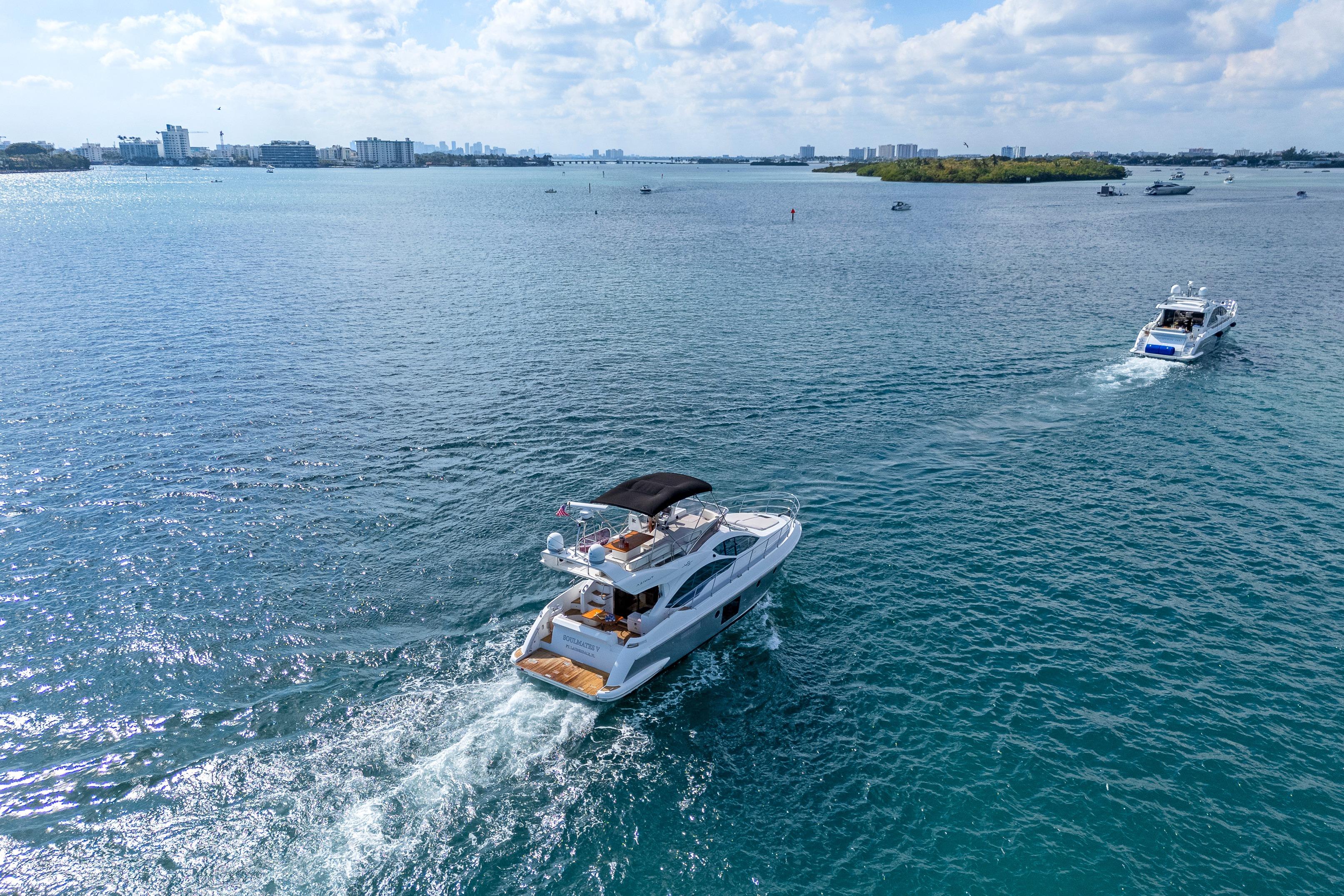 Azimut 45 Flybridge 2013 yacht cruising on a sunny day in open waters.