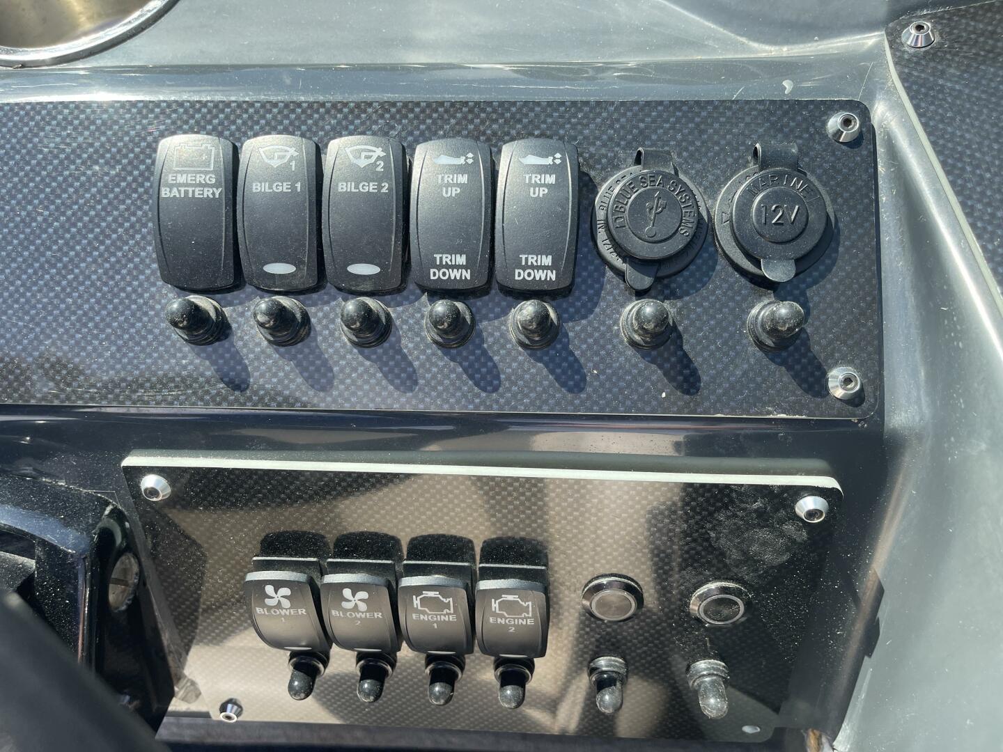 Control panel of a 1987 Sea Ray PACHANGA boat with various switches and dials.