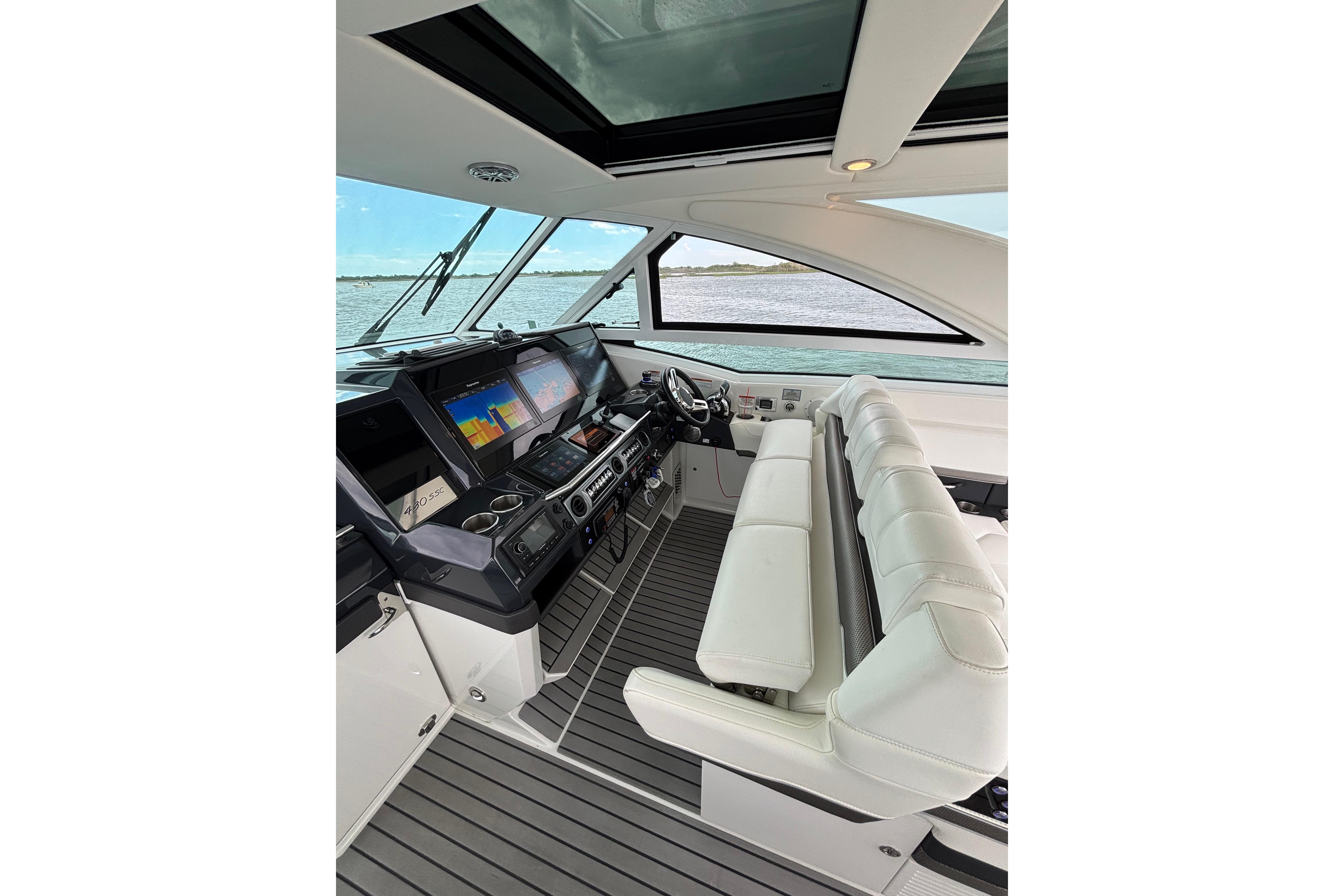 Interior of 2017 Formula 430 Super Sport Crossover yacht with modern dashboard and seating.