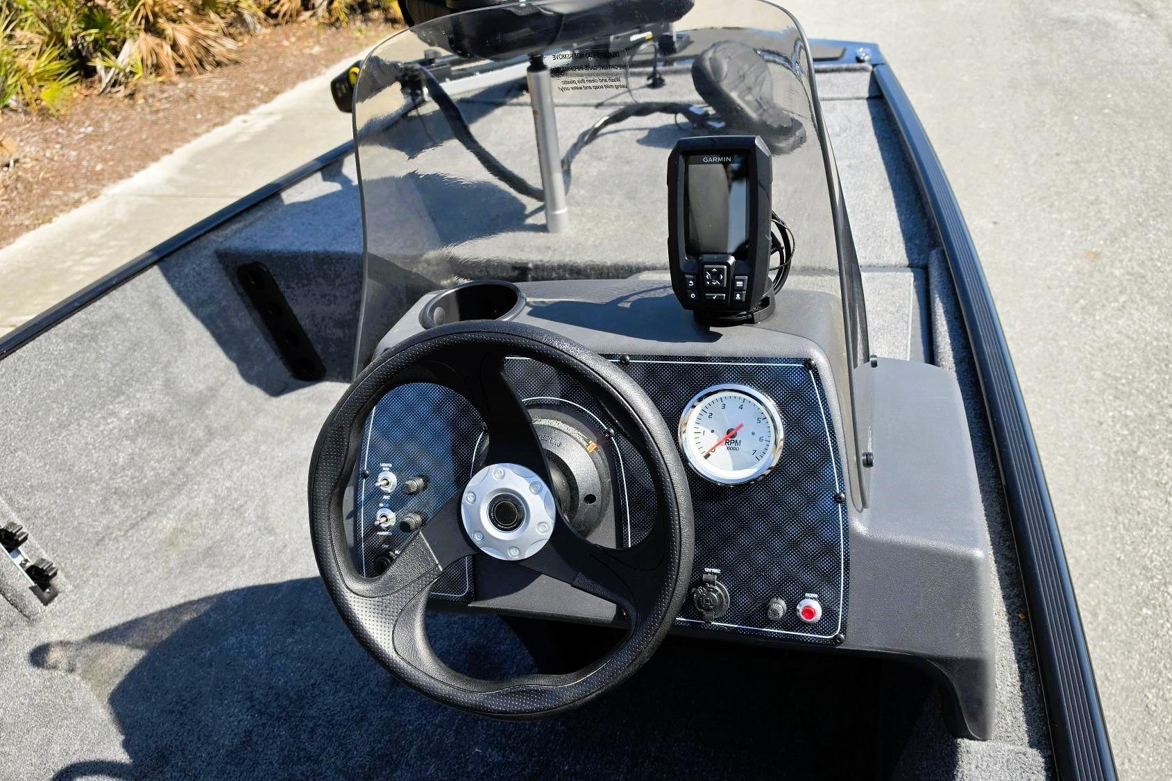 2026 Tracker Bass Tracker Classic XL dashboard with steering wheel and navigation system.