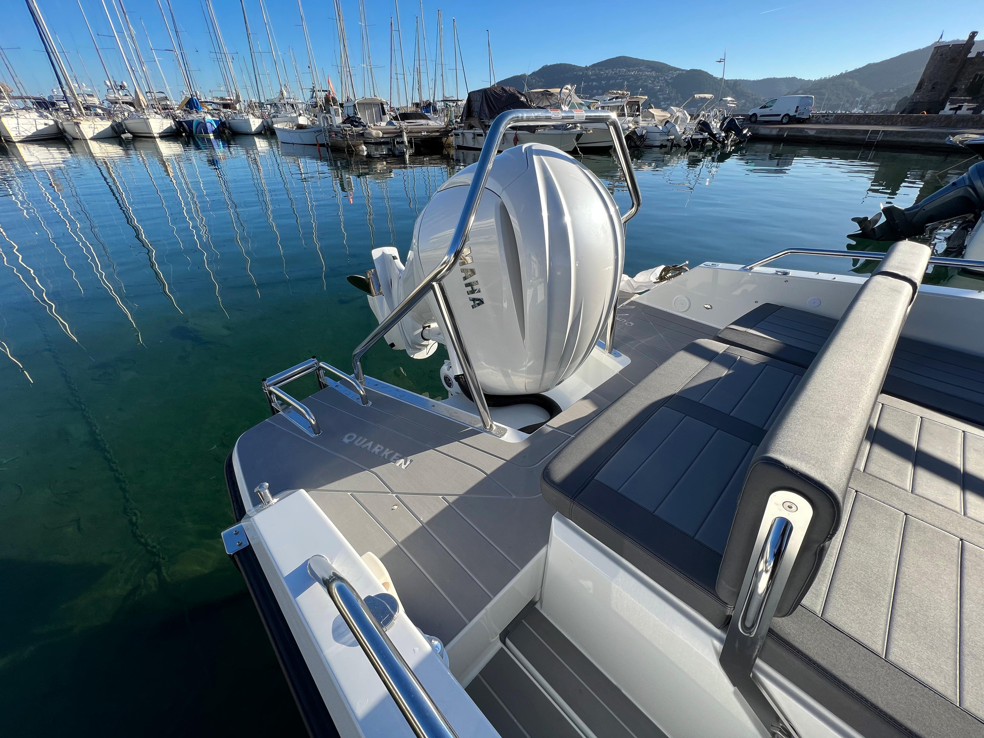 2025 Quarken 27 T-Top boat with Yamaha engine docked in marina.
