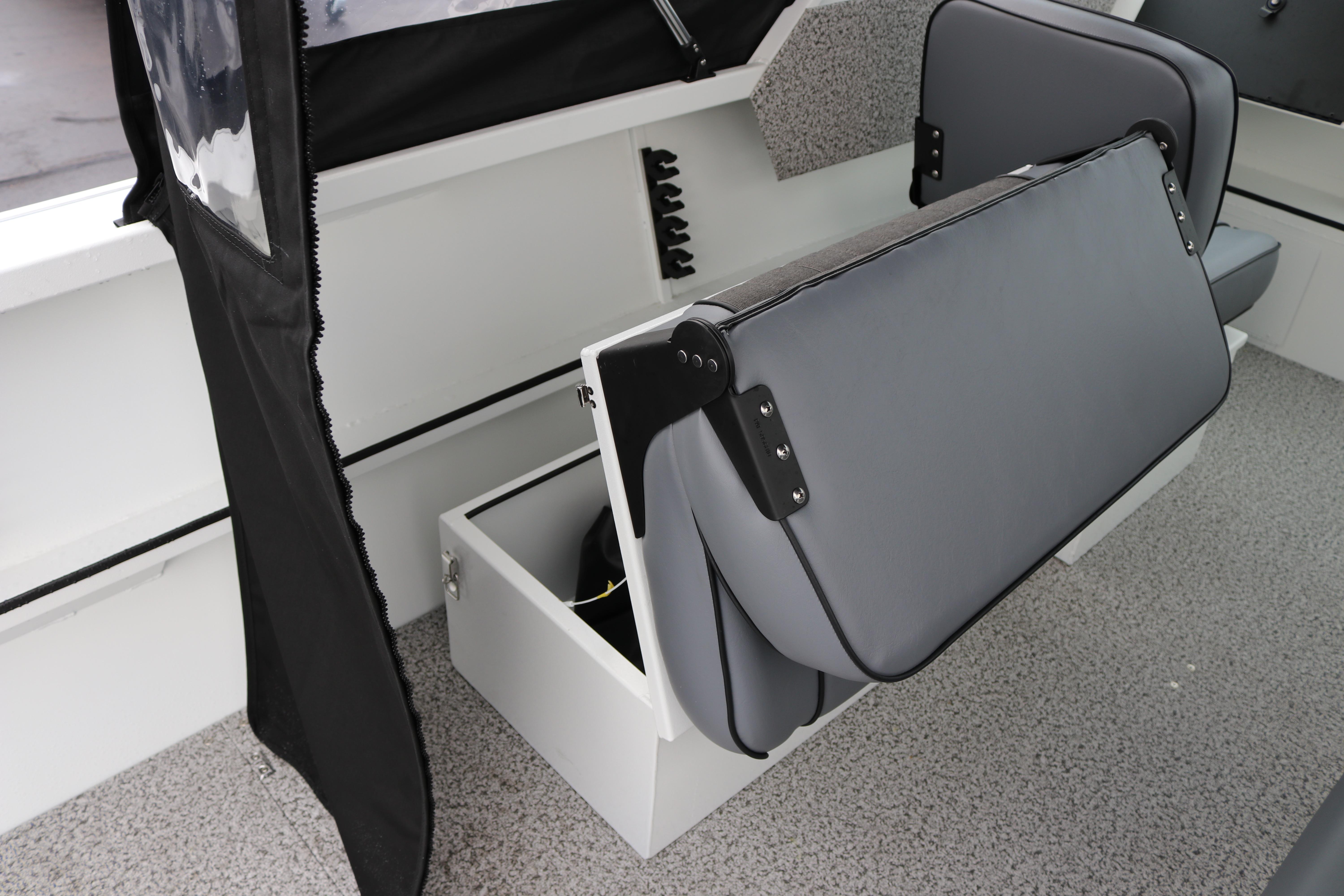 2026 Alumaweld Stryker 202 boat interior with foldable seating and storage compartment.