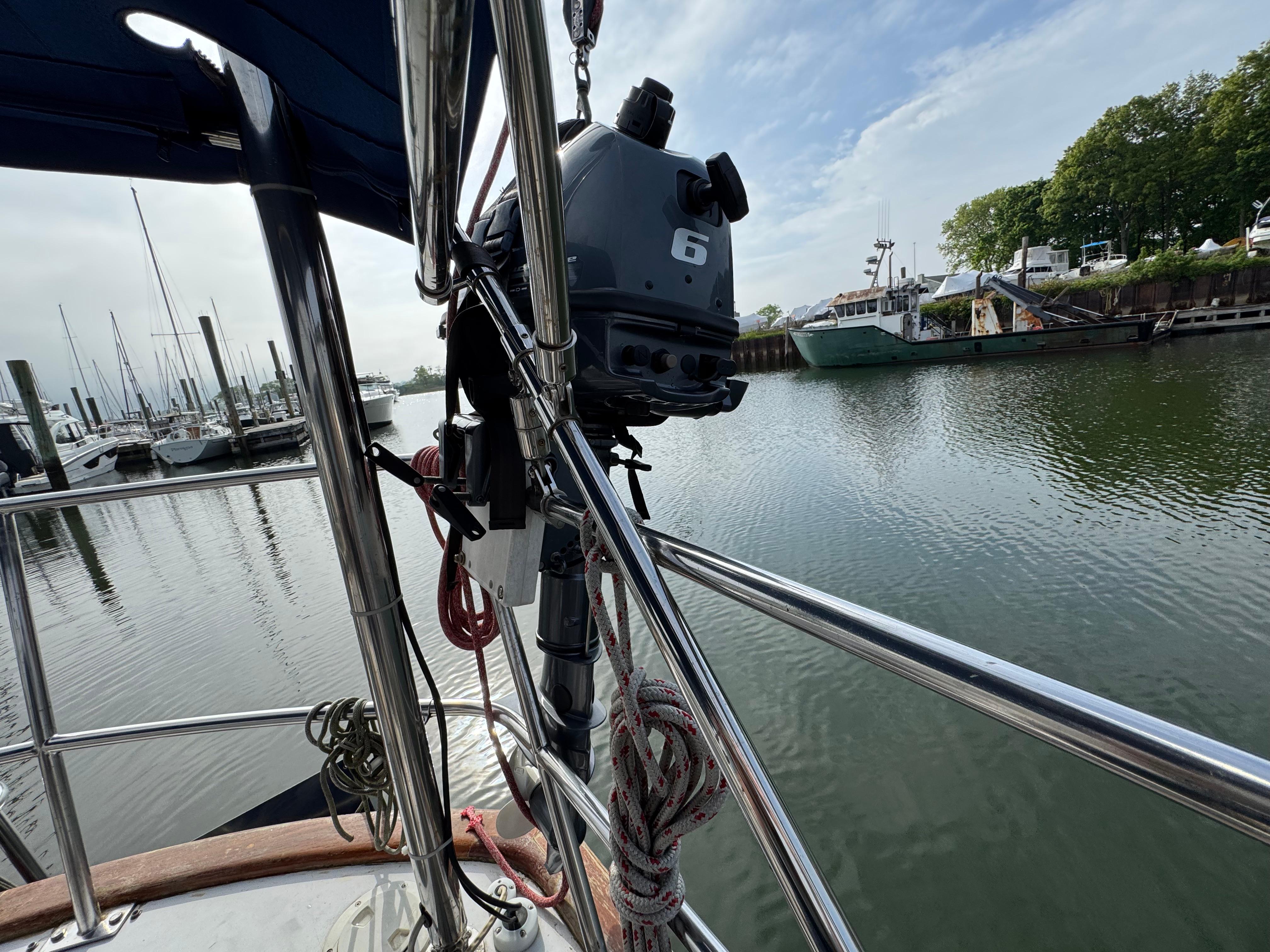 Sailboat deck view with motor, docked in a marina, Passport 40, 1982 model.