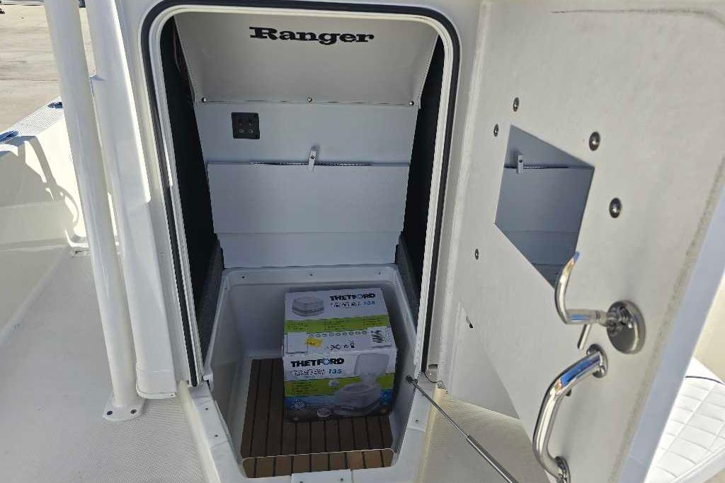 2025 Ranger 2510 Bay boat storage compartment with Thetford product inside.