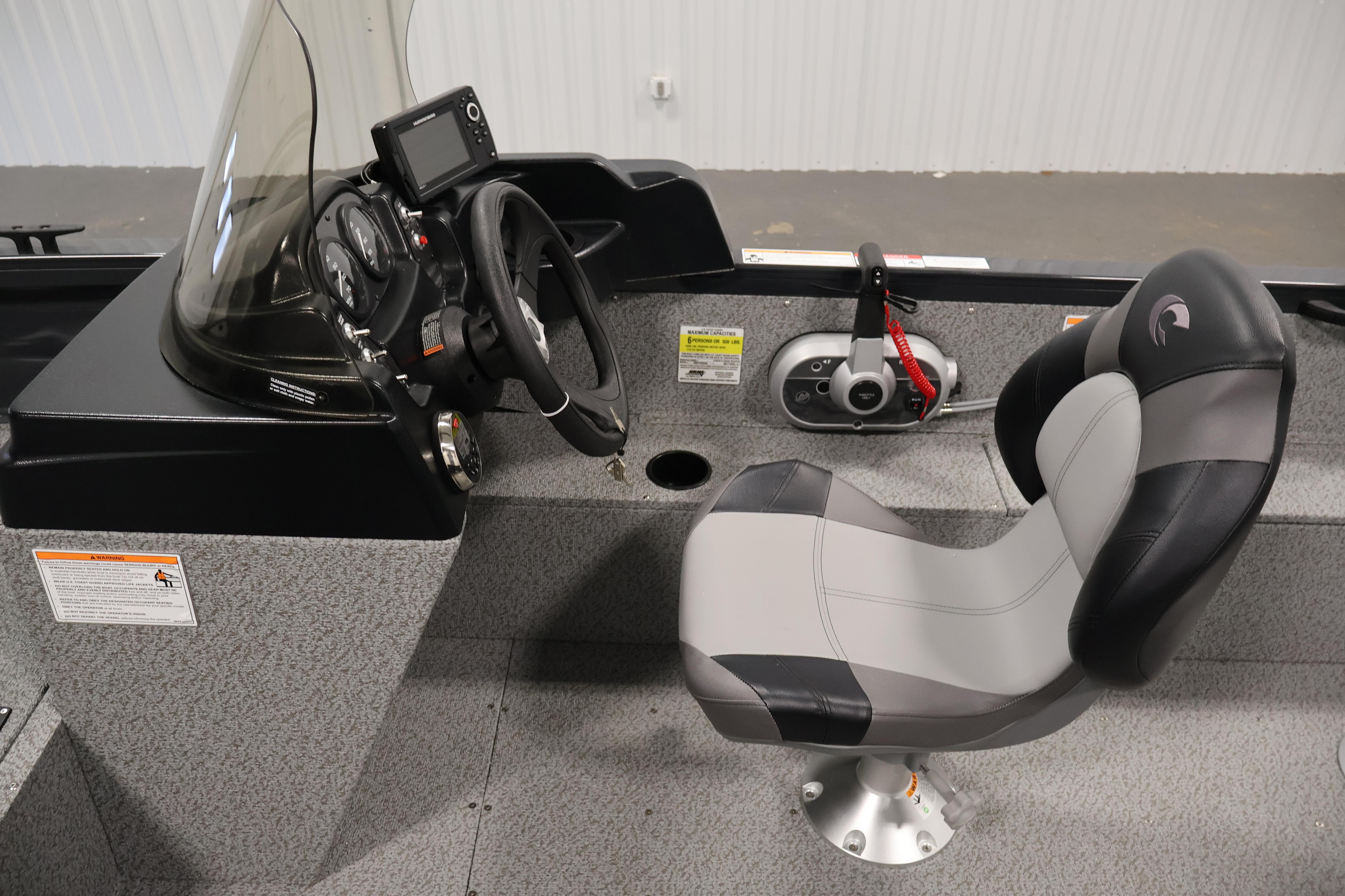 2026 Crestliner 1850 Kodiak SC boat interior with steering console and captain's chair.