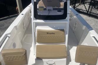 2023 Trophy T24 CC boat interior with beige seating and console.