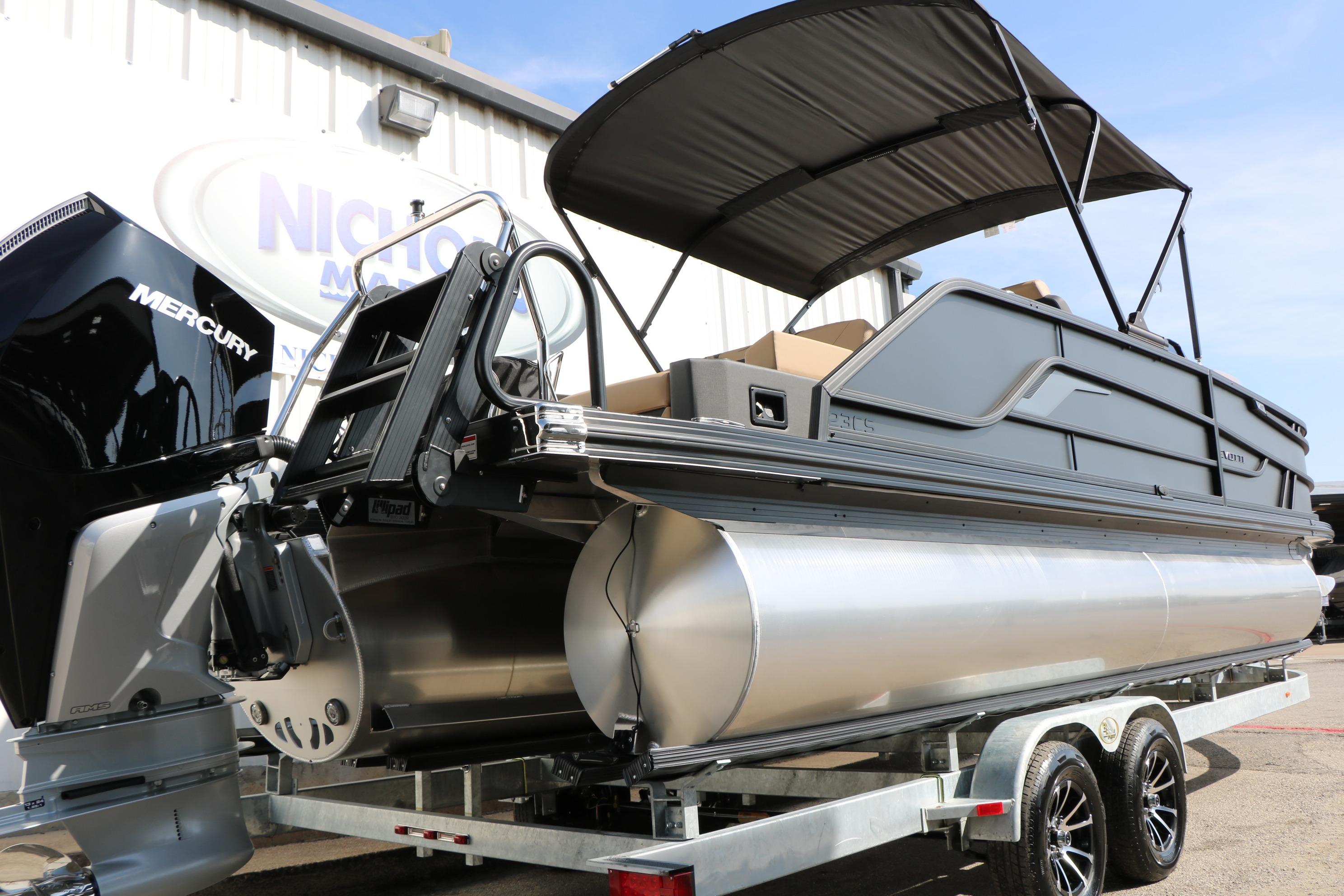 2026 Evotti 723CS pontoon boat with Mercury engine on a trailer.