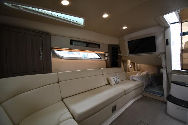 Luxurious interior of 2021 Regal 35 Sport Coupe with beige seating and modern amenities.