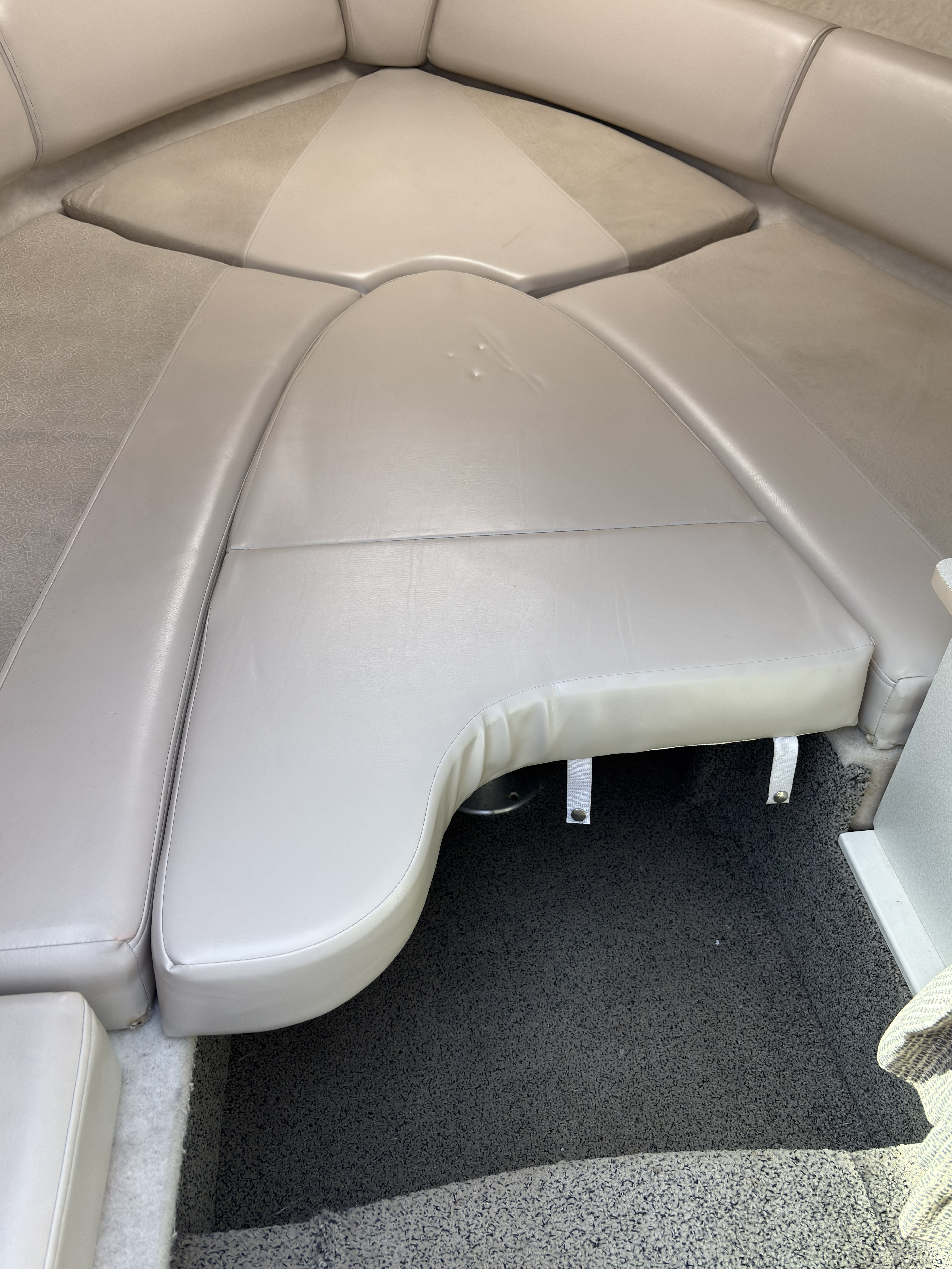 Interior of a 2005 Maxum 2400 SC3 boat with cushioned seating.