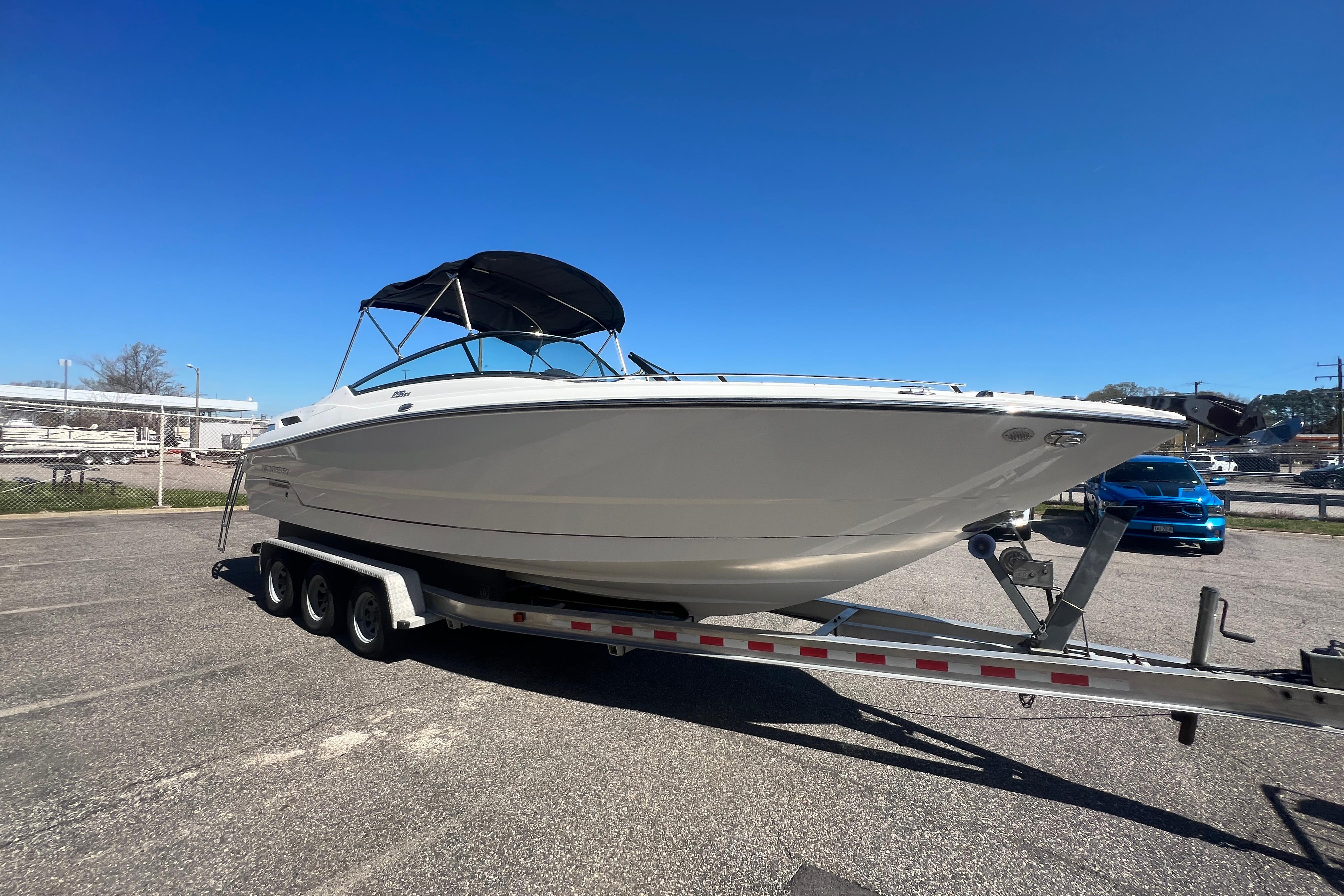 2017 Monterey 298SS Super Sport boat on trailer under clear blue sky.