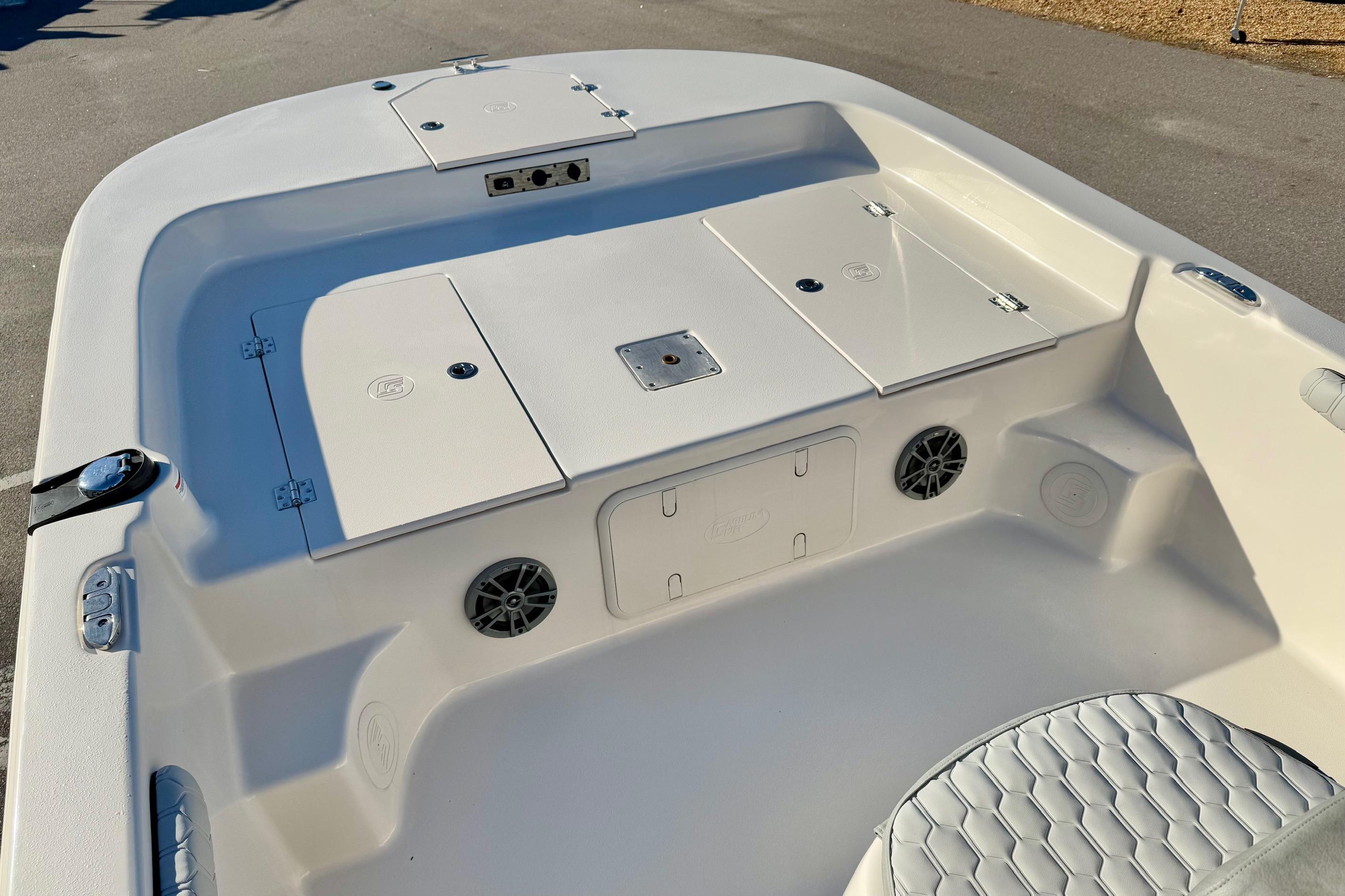 2025 Carolina Skiff 21 LS boat interior with storage compartments and seating.