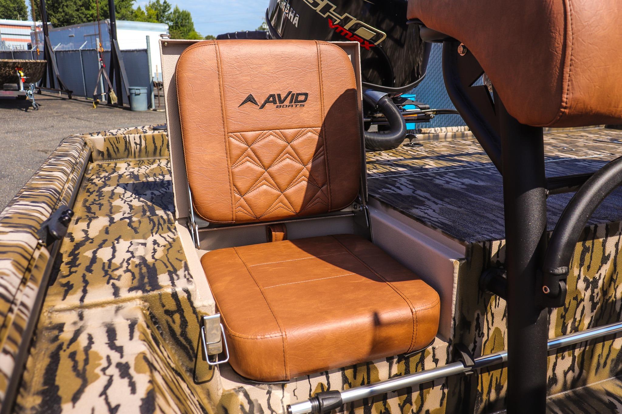 A brown leather seat with Avid Sports logo on a boat.