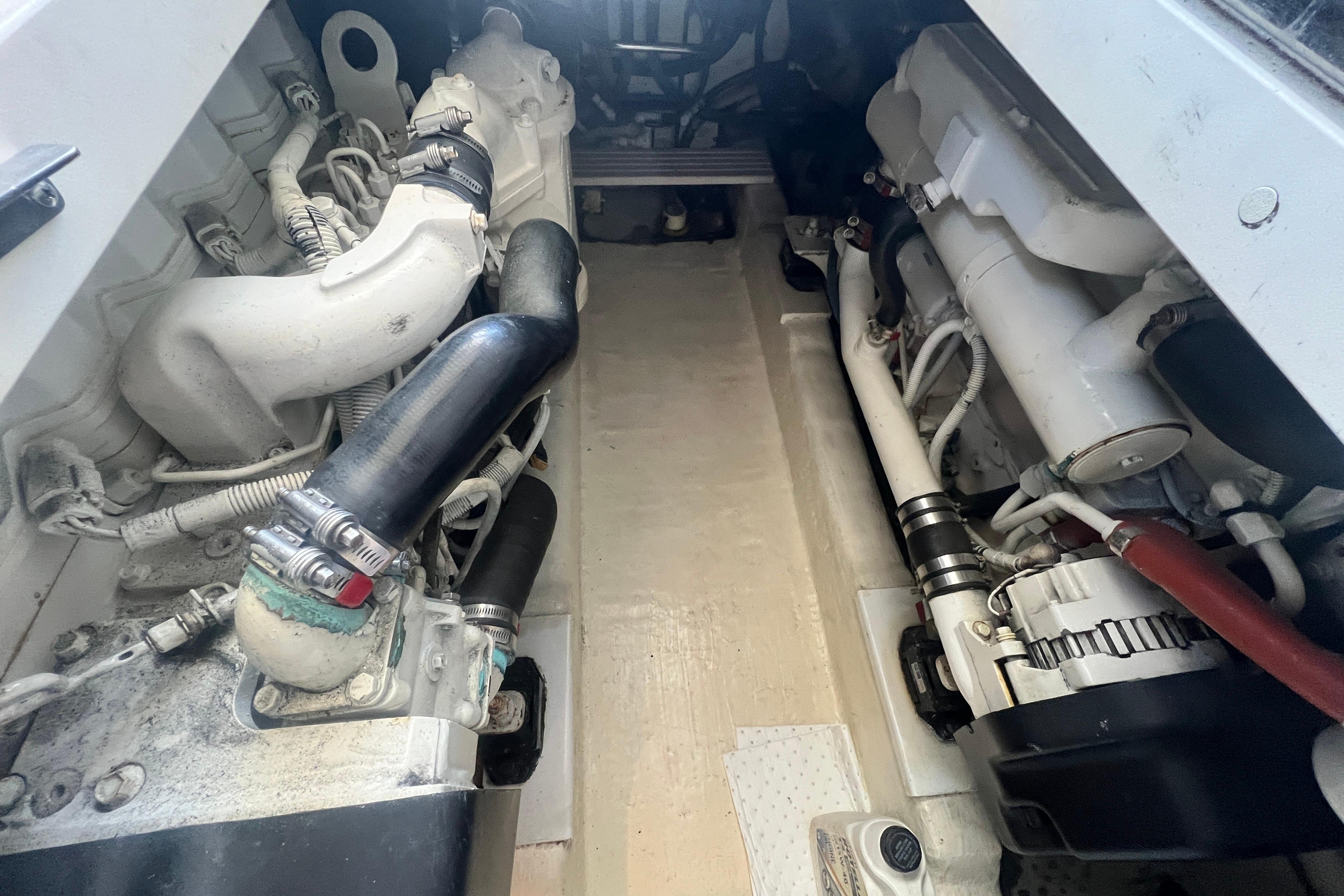 Engine compartment of a 2007 Riviera 33 Flybridge boat, showcasing mechanical components.