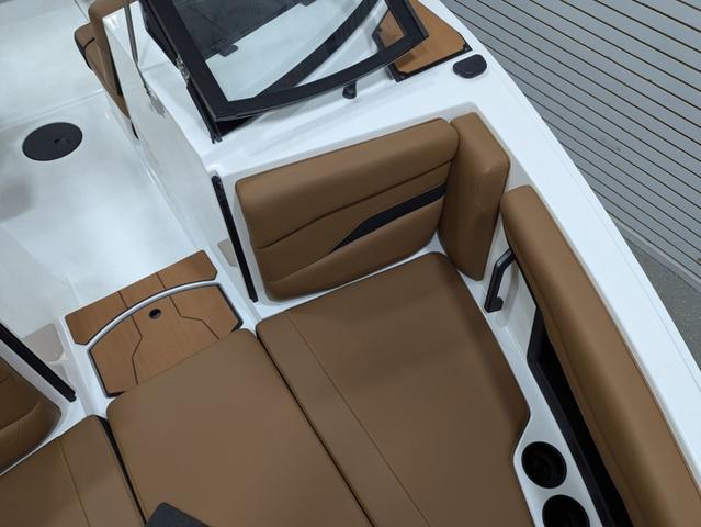 2025 Axis Wake Research T220 boat interior with brown seating and modern design.