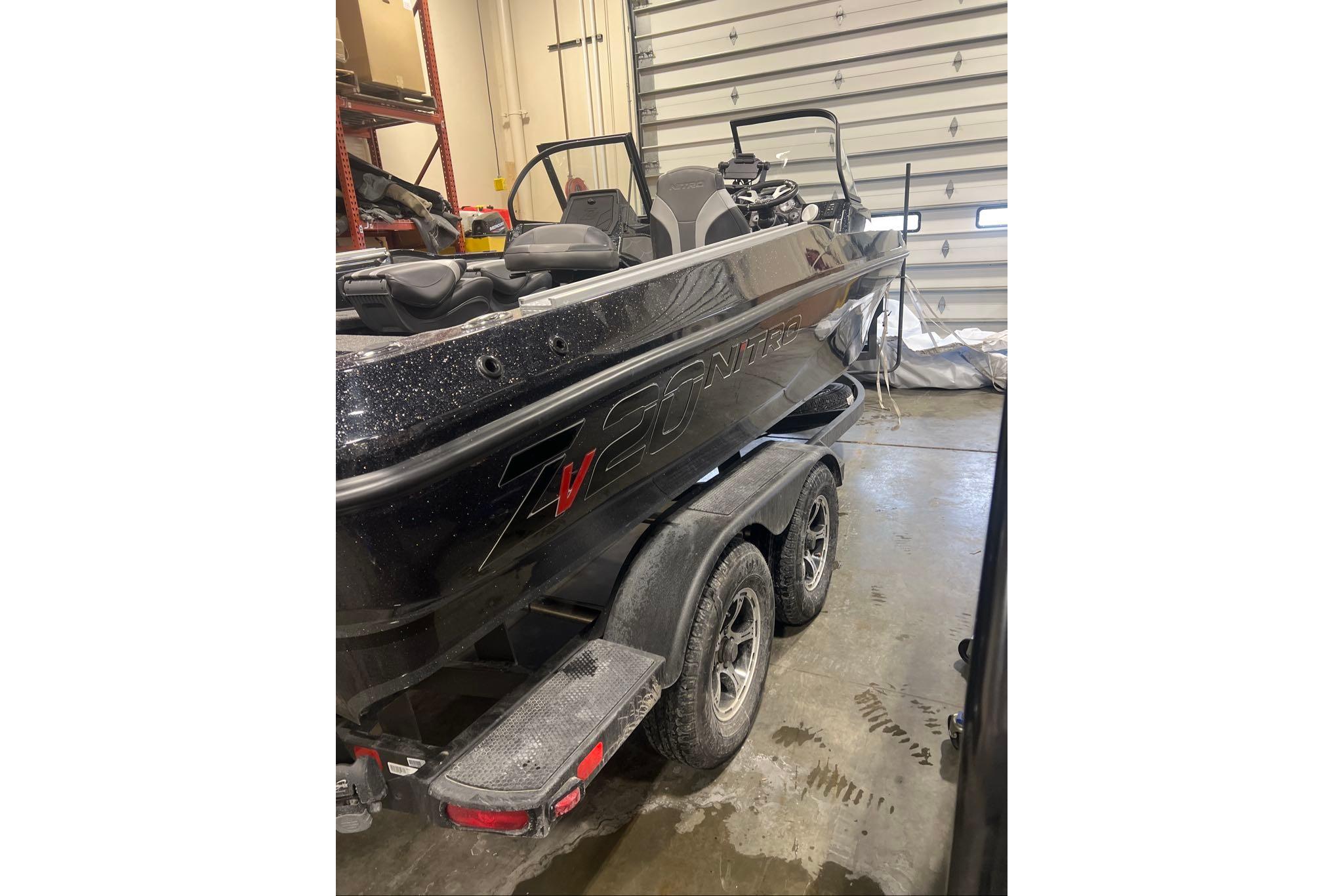 2026 Nitro ZV20 Pro boat in a garage, showcasing sleek design and dual-axle trailer.