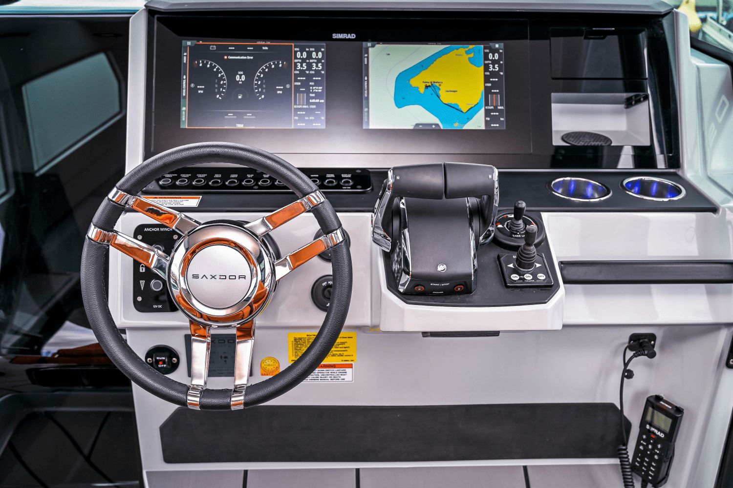 Helm of the Saxdor SX320 GTO with modern instruments and chart display.