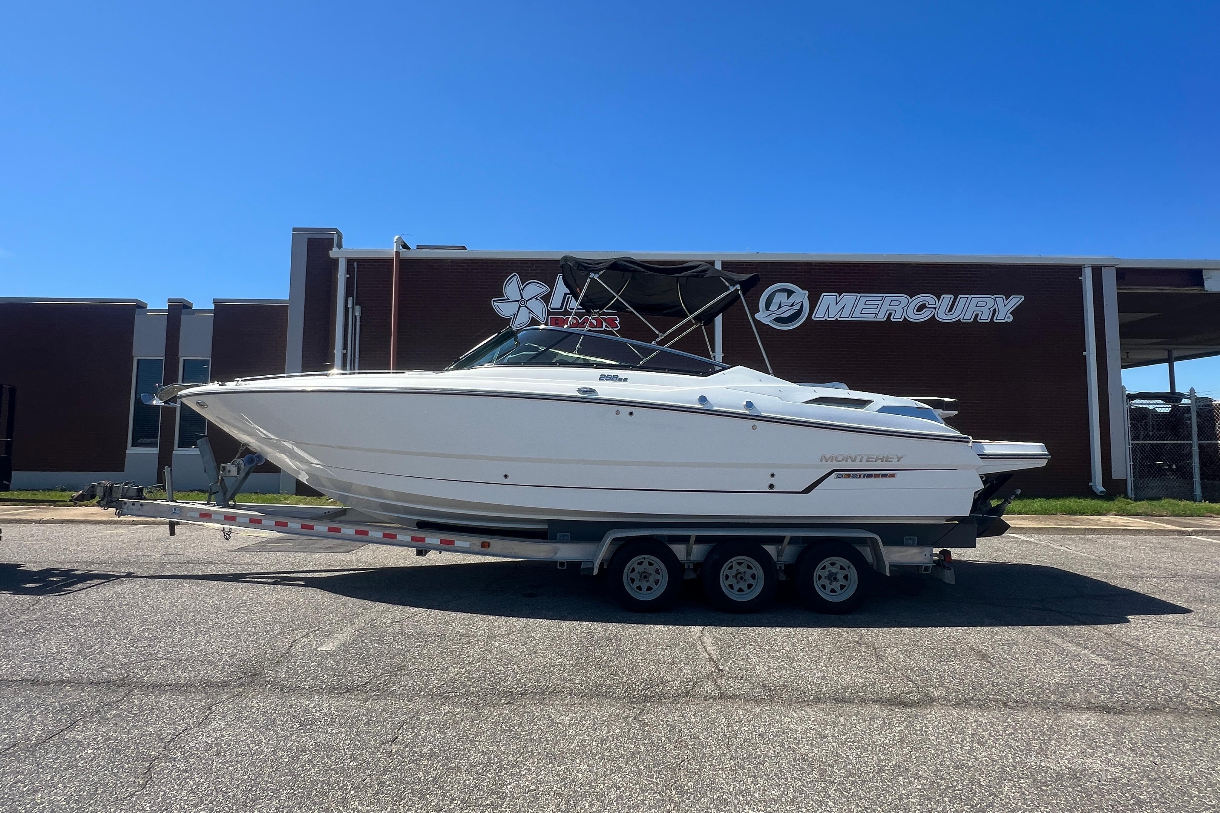 2017 Monterey 298SS Super Sport boat on trailer, parked outside Mercury building.