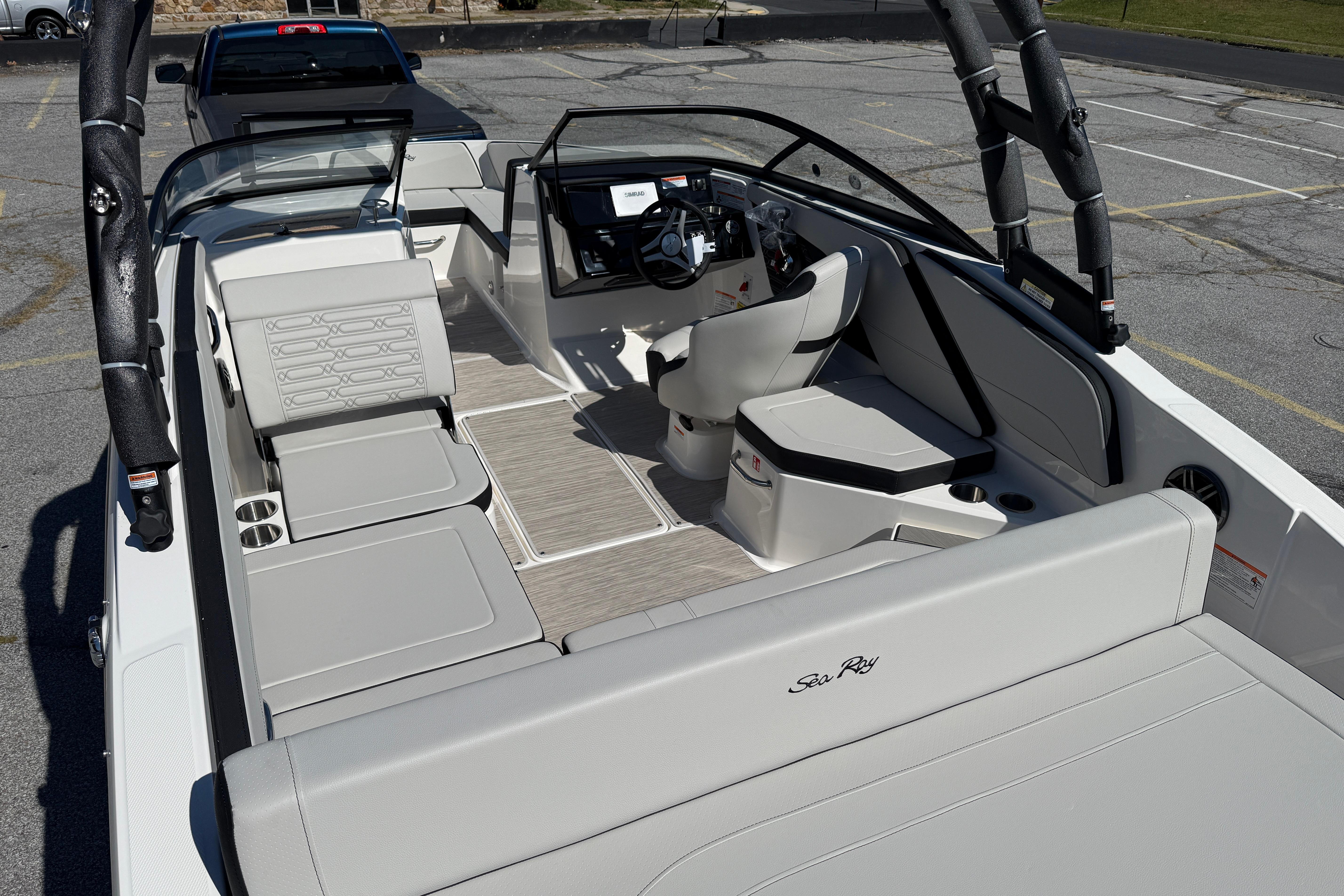 2026 Sea Ray SPX 210 boat interior with sleek seating and modern dashboard design.