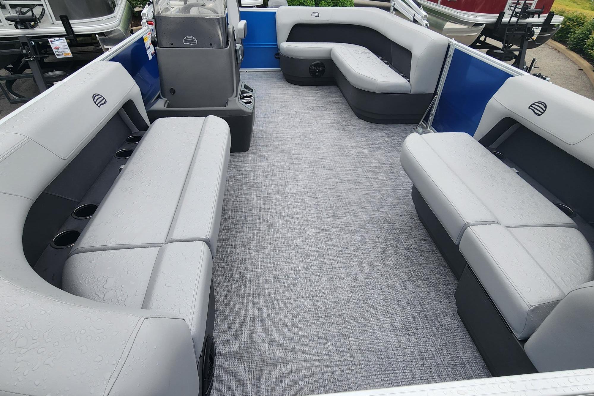2026 Sun Tracker Party Barge 16 DLX interior with gray seating and spacious layout.