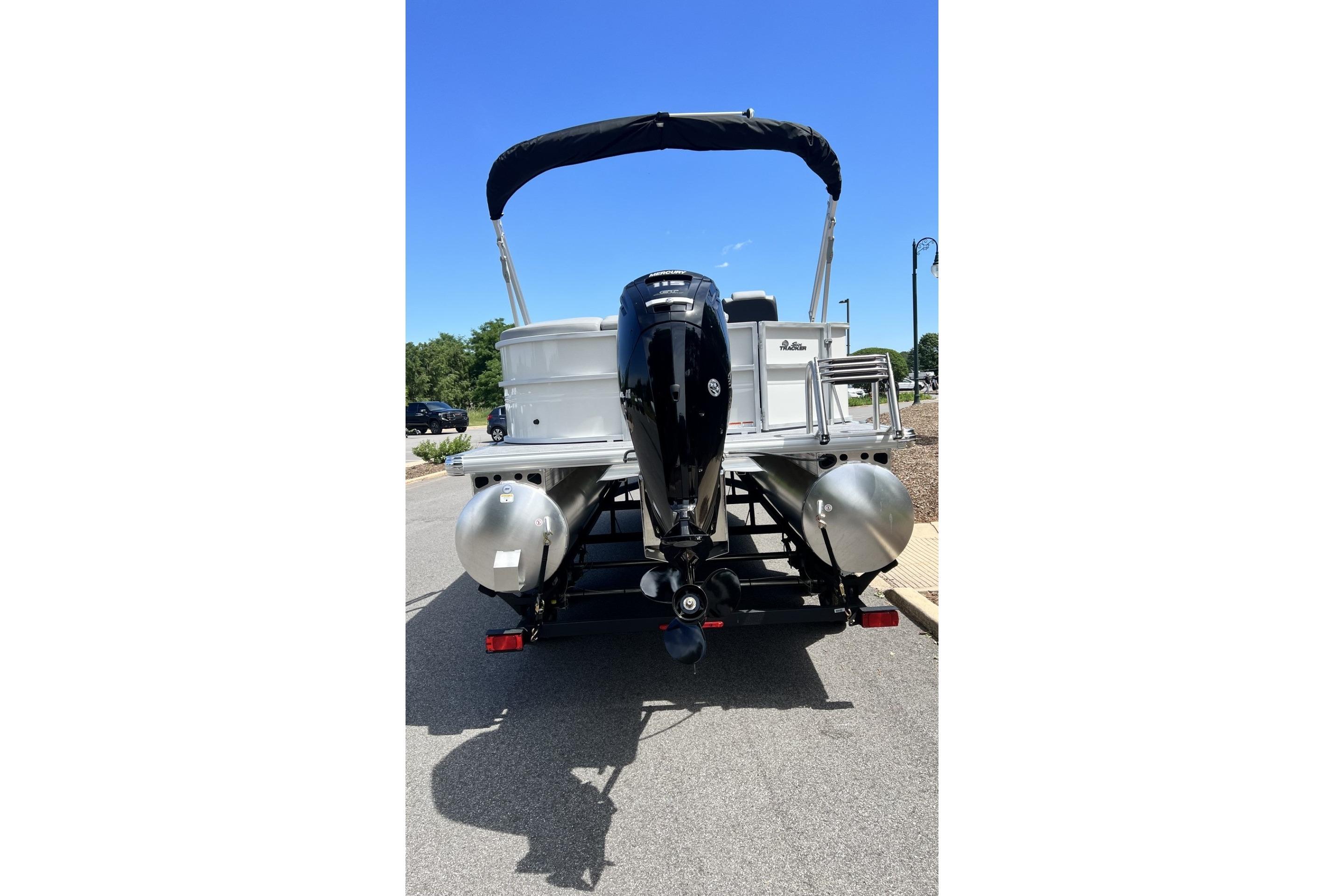 2026 Sun Tracker Party Barge 20 DLX pontoon boat, rear view with outboard motor.