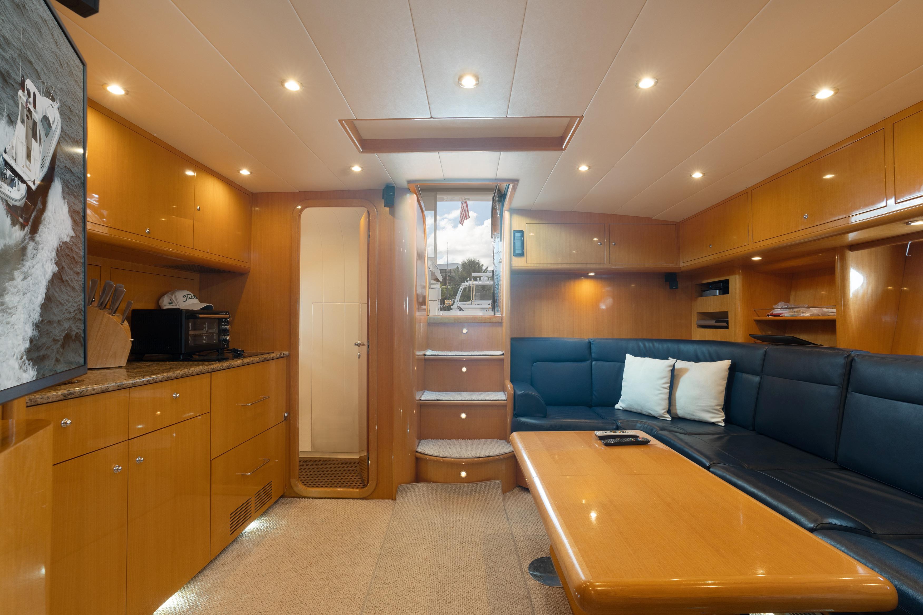 Luxurious interior of 2001 Uniesse 48 Open yacht with modern furnishings and lighting.