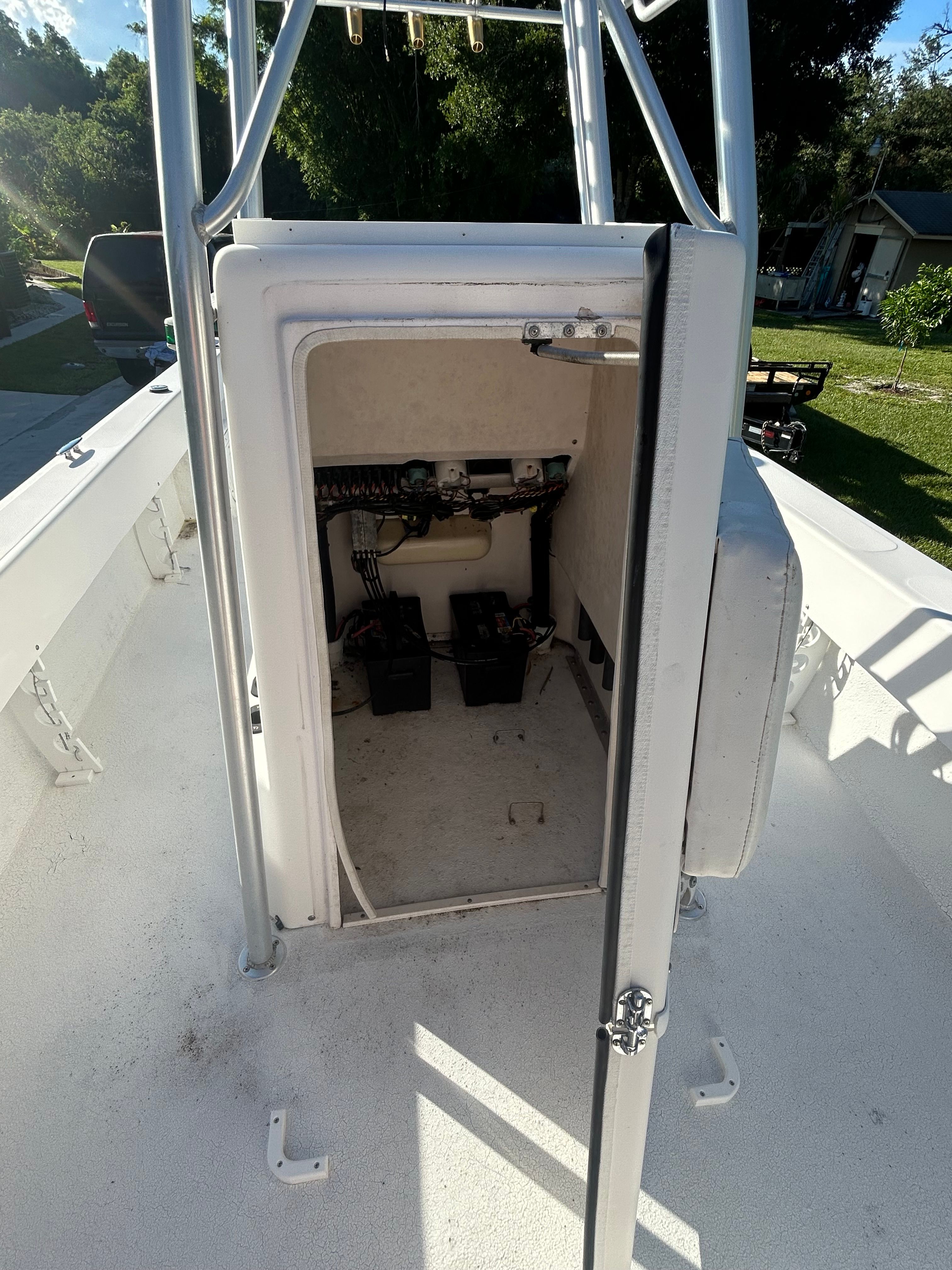 An open storage compartment on a 2007 Twin Vee 26 Center Console boat.